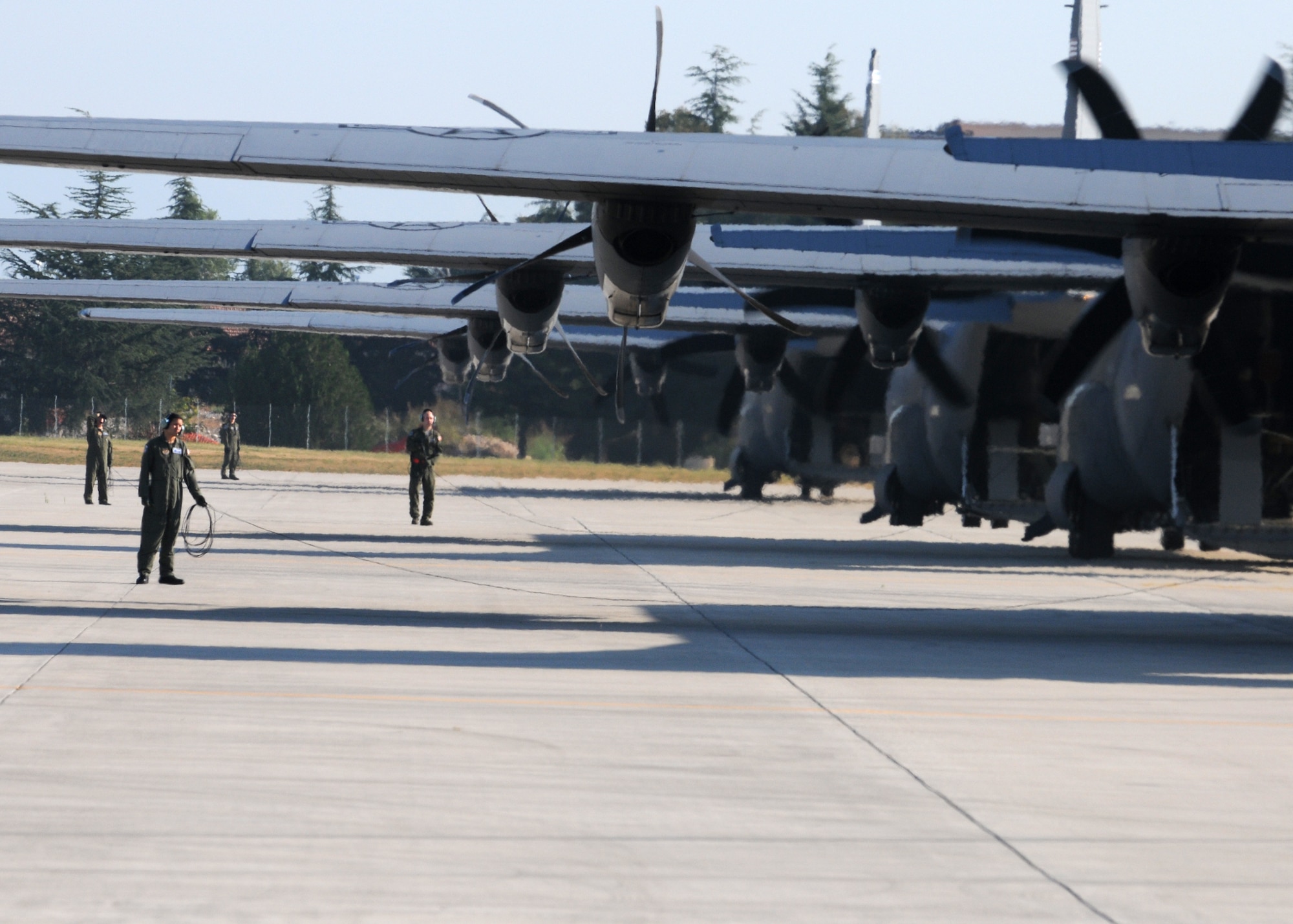 Aircrew members perform pre-flight checks on a fleet of C-130 Hercules Oct. 5 at Aviano Air Base, Italy, in support of the 173rd Airborne Brigade Combat Team's first full-spectrum training operation in Europe. The 173rd ABCT, stationed at Vicenza, Italy, leads the efforts in the first brigade-sized operation in Europe since 2003 that includes more than 1,300 U.S. military an joint partner nation paratroopers. (U.S. Air Force photo/Staff Sgt. Nadine Barclay)