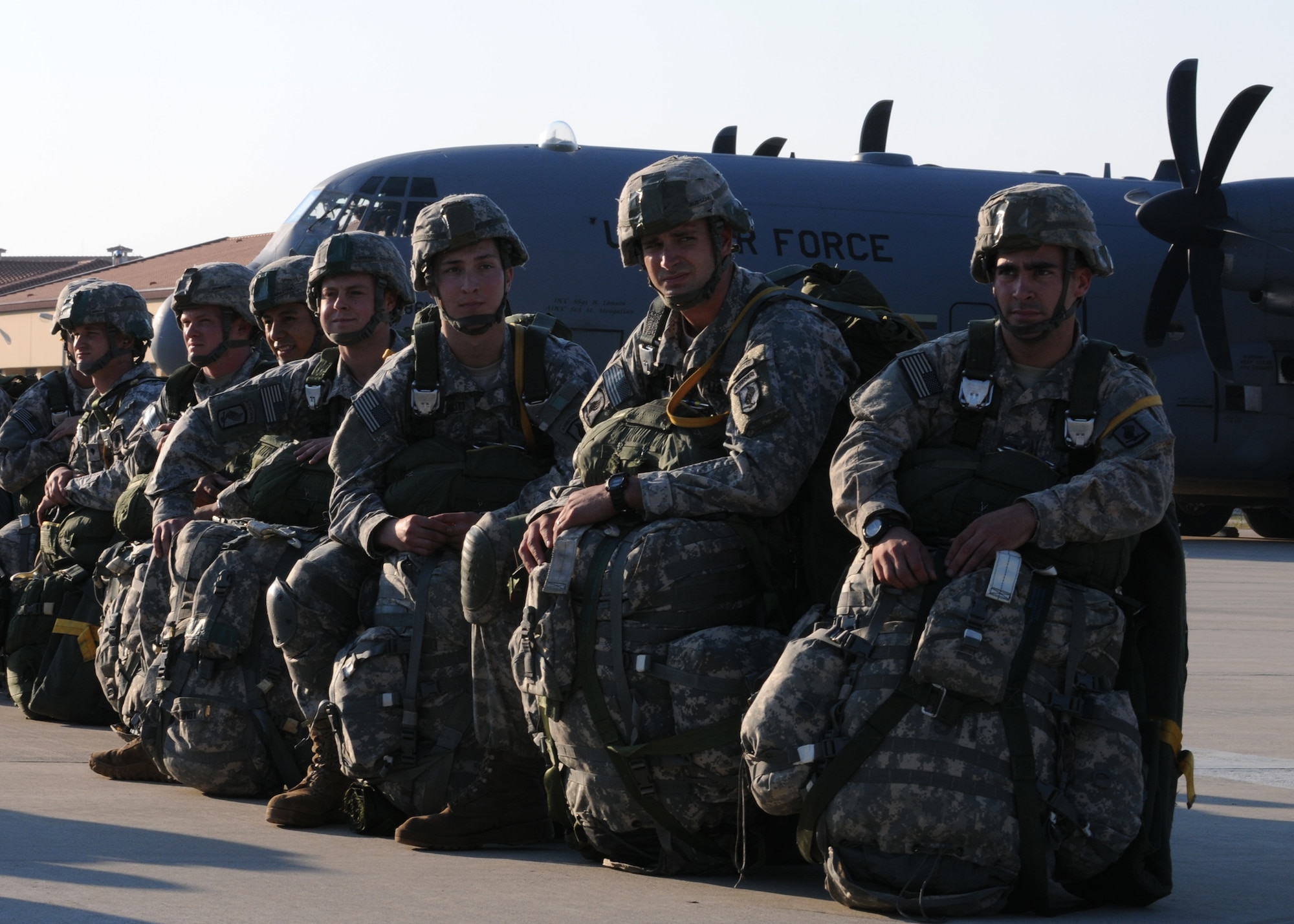 Soldiers with the 173rd Airborne Brigade Combat Team prepare to board a C-130 Hercules Oct. 5 at Aviano Air Base, Italy, in preparation of the unit's first full-spectrum training operation in Europe. The 173rd ABCT, stationed at Vicenza, Italy, leads the efforts in the first brigade-sized operation in Europe since 2003 that includes more than 1,300 U.S. military an joint partner nation paratroopers. (U.S. Air Force photo/Staff Sgt. Nadine Barclay)