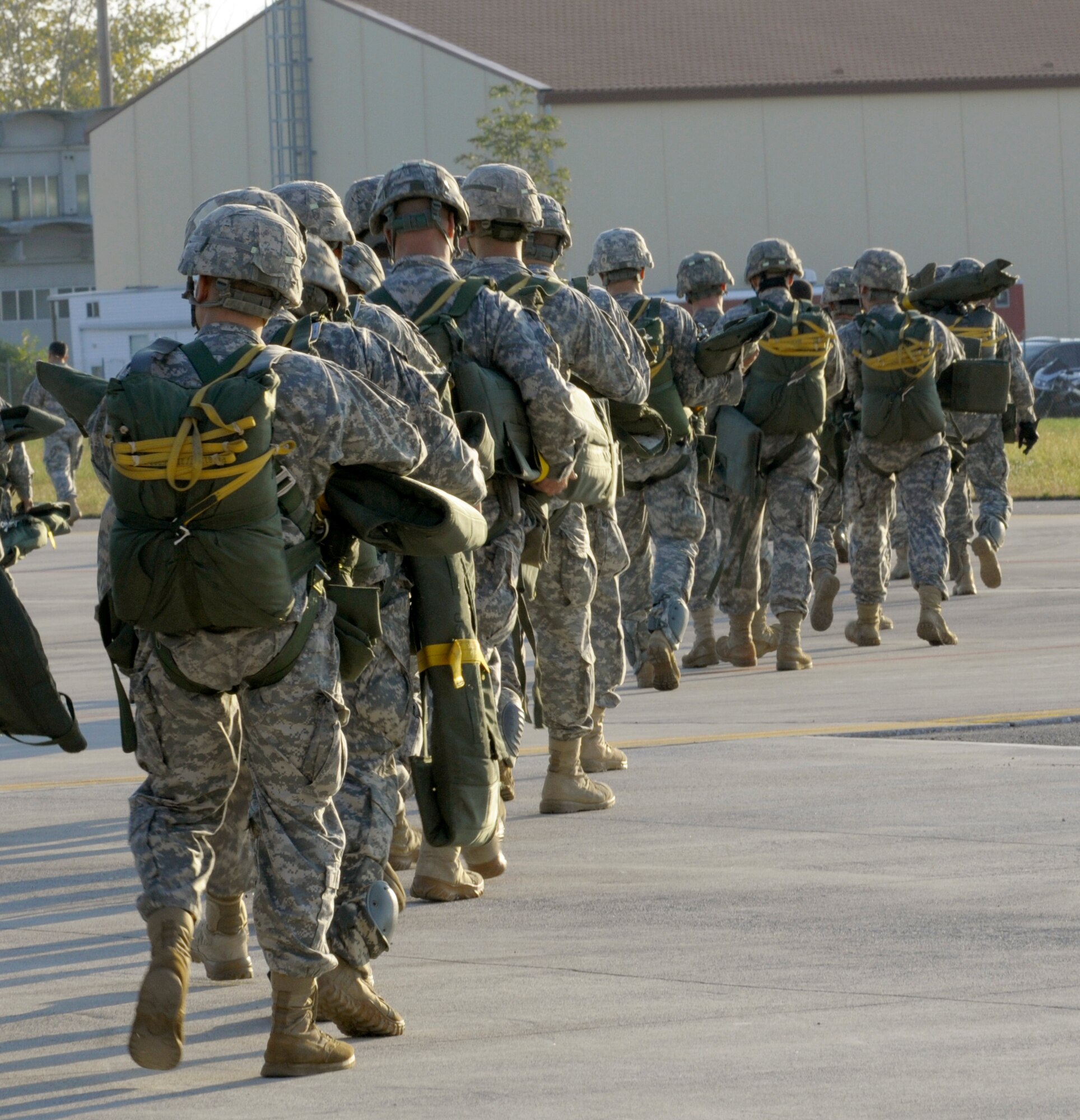 Soldiers with the 173rd Airborne Brigade Combat Team prepare to board a C-130 Hercules Oct. 5 at Aviano Air Base, Italy, in preparation for the the 173rd ABCT's first full-spectrum training in Europe. The 173rd ABCT, stationed in Vicenza, Italy, lead the effort as more than 1,300 U.S. military and joint partner nation paratroopers participated in the first brigade-sized operation in Europe since 2003. (U.S. Air Force photo/Airman 1st Class Brianna Jones)