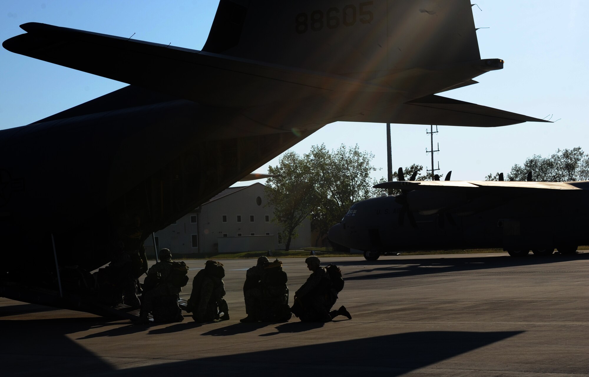 Soldiers with the 173rd Airborne Brigade Combat Team prepare to board a C-130 Hercules Oct. 5 at Aviano Air Base, Italy, in preparation for the the 173rd ABCT's first full-spectrum training in Europe. The 173rd ABCT, stationed in Vicenza, Italy, lead the effort in the first brigade-sized operation in Europe since 2003. (U.S. Air Force photo/Airman 1st Class Brianna Jones)