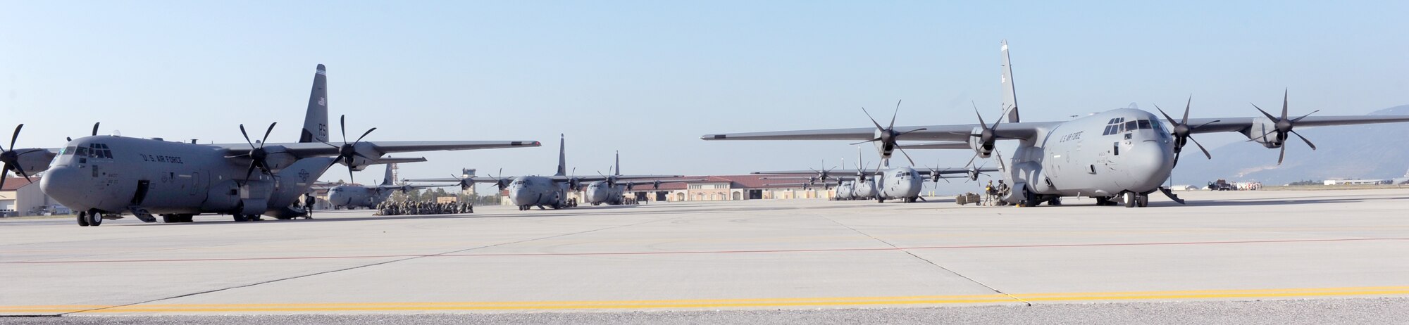 A fleet of C-130 Hercules aircraft wait on the flightline Oct. 5 at Aviano Air Base, Italy, in preparation for the the 173rd Airborne Brigade Combat Team's first full-spectrum training in Europe. The 173rd ABCT, stationed in Vicenza, Italy, leads the effort in the first brigade-sized operation in Europe since 2003. (U.S. Air Force photo/Airman 1st Class Brianna Jones)