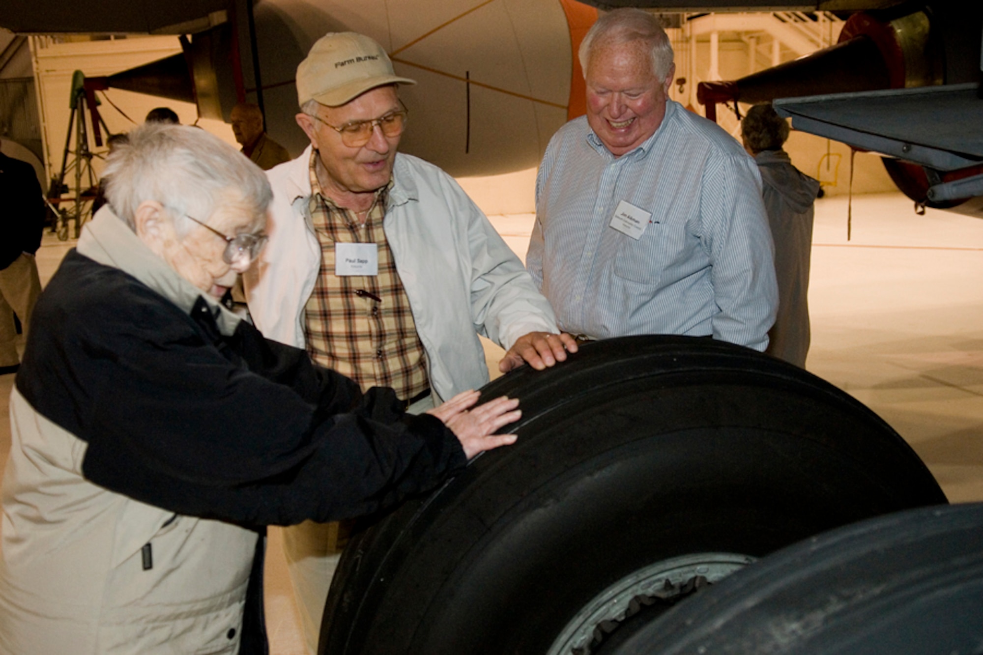 GRISSOM AIR RESERVE BASE, Ind. -- Civic leaders get a closer look at the rear tire of a KC-135R Stratotanker during a tour of a static display here following a base rededication ceremony Sept. 30. The tour was aimed at giving them better insight into what Grissom has to offer. Pictured left to right is Claire Saul, Paul Sapp, and Jim Aikman. The base was rededicated in the honor of Lt. Col. Virgil I. "Gus" Grissom, who tragically lost his life during a training mission aboard Apollo I. (U.S. Air Force photo/Senior Airman Jami K. Lancette)