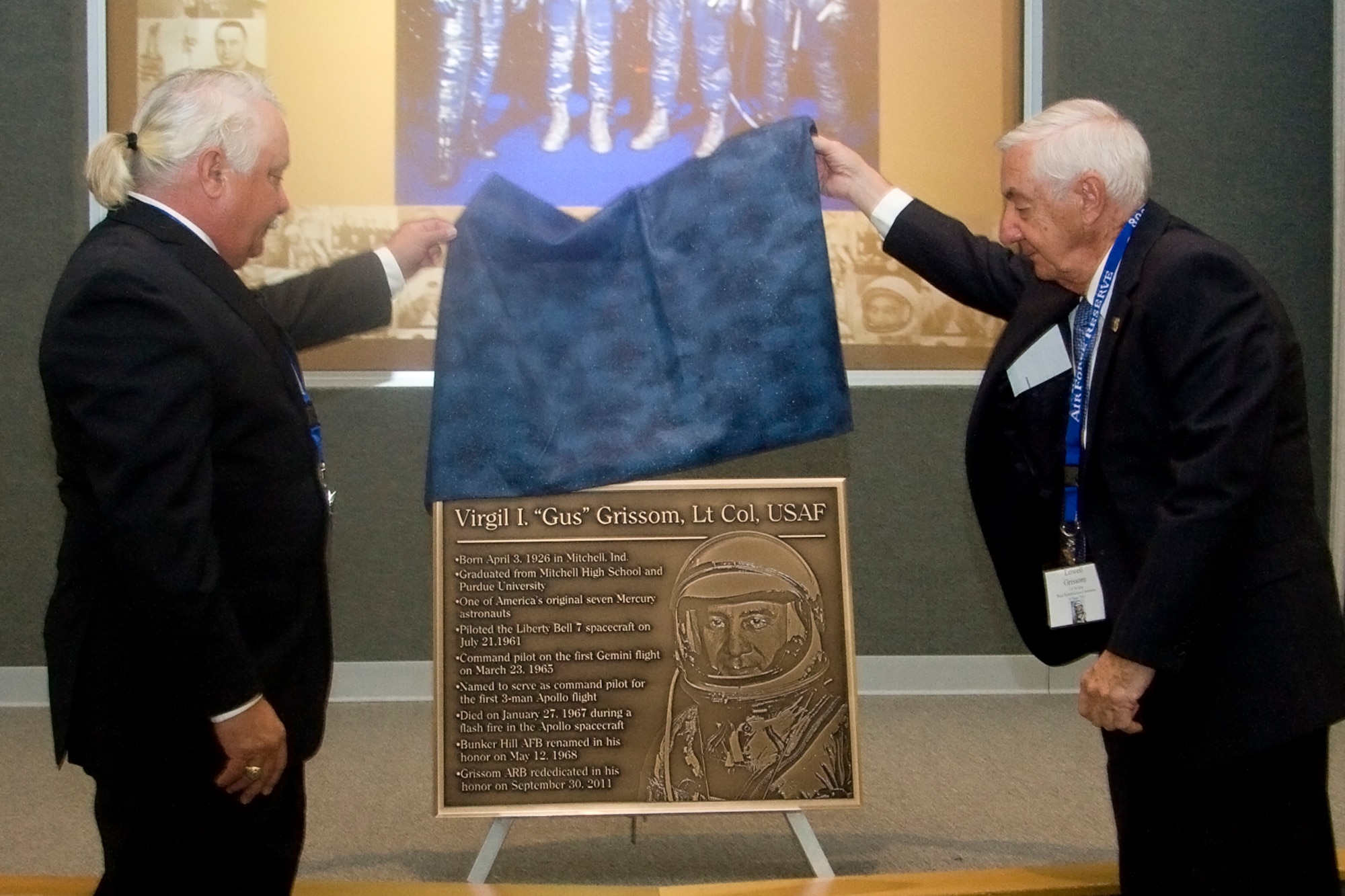 GRISSOM AIR RESERVE BASE, Ind. -- Scott Grissom, left, and Lowell Grissom unveil a special brass plaque in honor of Lt. Col. Virgil I. "Gus" Grissom during a base rededication ceremony held here Sept. 30. Scott is the son of Gus and Lowell is his brother. (U.S. Air Force photo/Tech. Sgt. Mark R. W. Orders-Woempner) 
