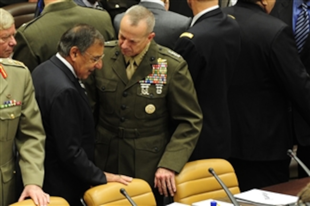 Secretary of Defense Leon Panetta talks with U.S Marine Gen. John Allen, International Security Assistance Force commander, before a summit with NATO ministers of defense and representatives from non-NATO ISAF contributing nations at NATO headquarters in Brussels, Belgium, Oct. 6, 2011.  Panetta is meeting with his NATO counterparts and defense leaders to discuss lessons learned during NATO operations in Libya and Afghanistan and the future defense needs of the alliance.  