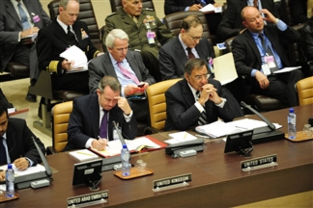 Secretary of Defense Leon Panetta, right, listens to the speaker during the Defense Ministerial at NATO headquarters in Brussels, Belgium, Oct. 6, 2011.  Panetta is meeting with his NATO counterparts and defense leaders to discuss lessons learned during NATO operations in Libya and Afghanistan and the future defense needs of the alliance.  