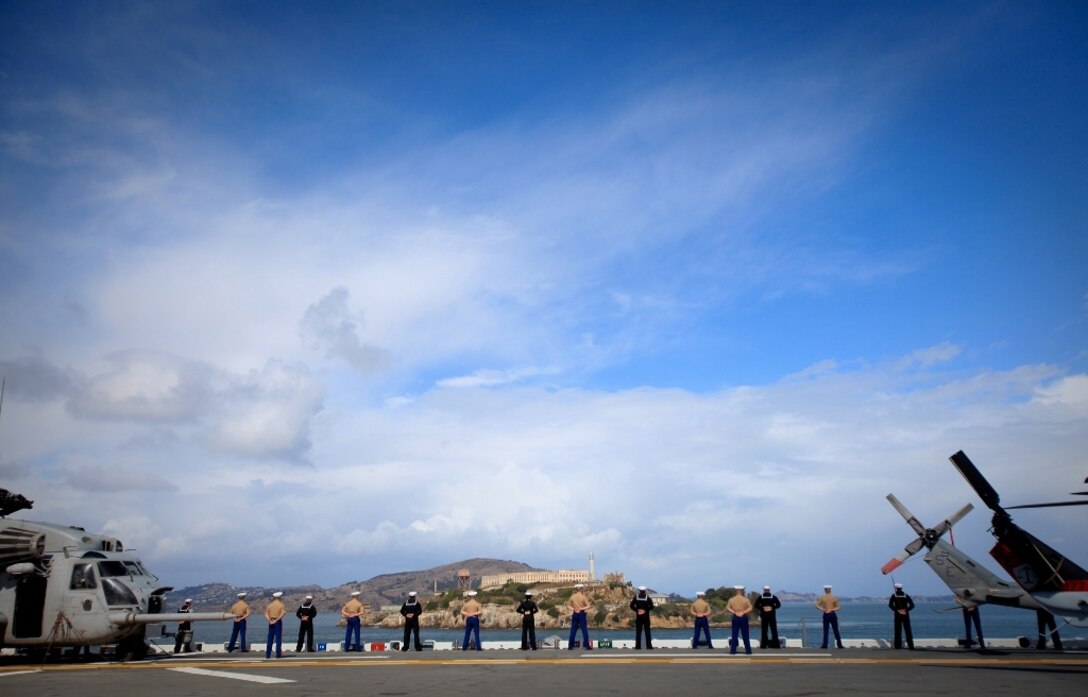 Marines serving with I Marine Expeditionary Force and sailors serving aboard the USS Bonhomme Richard man the rails aboard the ship, Oct. 5, 2011, while the vessel passes Alcatraz in the San Francisco Bay. The service members aboard USS Bonhomme Richard ported in San Francisco for Fleet Week, an annual event for the city and nearby communities, to demonstrate the Navy and Marine Corps as an asset for the Bay Area in response to a sudden crisis.