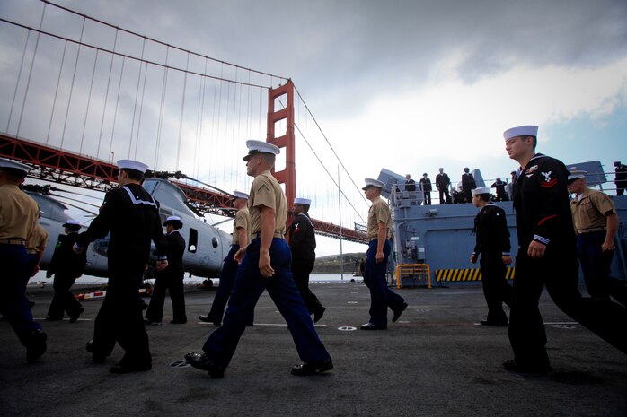 Marines serving with I Marine Expeditionary Force and sailors serving aboard the USS Bonhomme Richard march down the flight deck of the ship to man the rails, Oct. 5, 2011, while the vessel pulls in to the San Francisco Bay for Fleet Week. The focus for San Francisco Fleet Week is to showcase the Navy and Marine Corps’ amphibious nature, readiness and ability to respond to disasters worldwide.