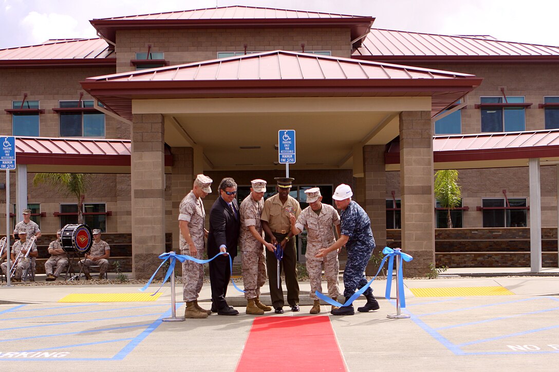 Camp Pendleton military officials and Sean Hulen, vice president of the construction company, cut the ceremonial ribbon during the opening of the Hope and Care Center at Wounded Warrior Battalion West, Oct. 8. The new facility will serve as a rehabilitation center for wounded, ill and injured Marines and sailors during their recovery time.