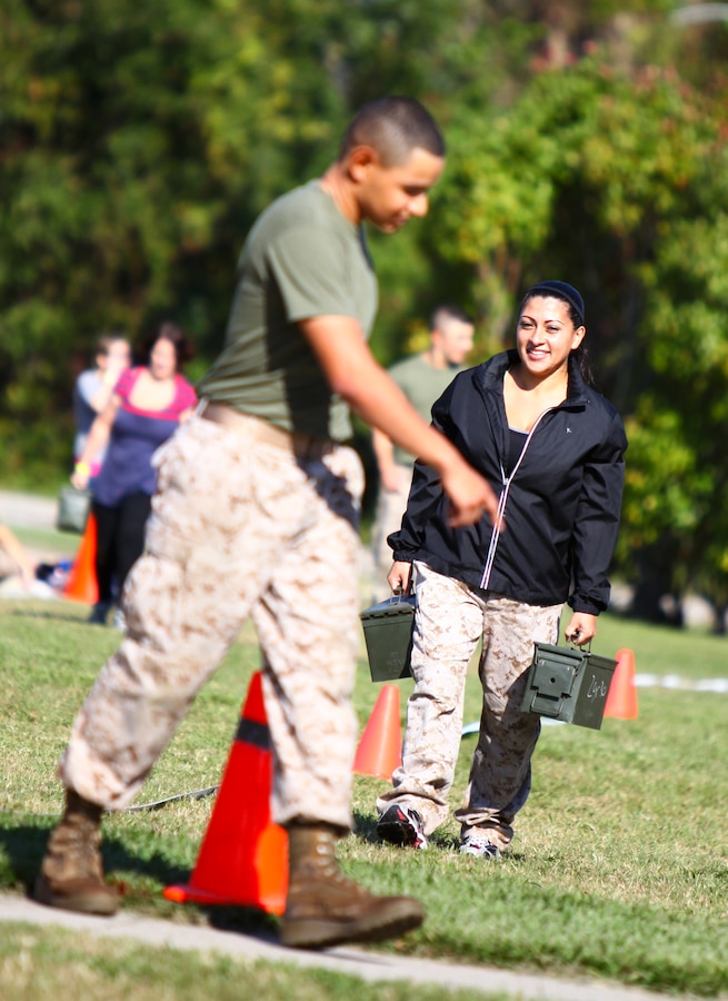 Cathy Hernandez, a native of Corona, Calif., and spouse of Cpl. Abel Hernandez, with Headquarters and Service Company, 1st Battalion, 2nd Marine Regiment, participates in a Combat Fitness Test during Jane Wayne Day on Camp Lejeune, N.C., Oct. 6, 2011. Spouses and families of the 24th Marine Expeditionary Unit's  Battalion Landing Team came together to participate in various events such as Marine Corps Martial Arts Program,  CFT, and Rifle Marksmanship.