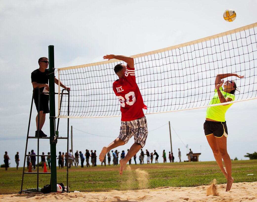 1st Lt. Kerry Friedewald (right), adjutant, Headquarters and Service Battalion, U.S. Marine Corps Forces, Pacific, plays volleyball at the Bordelon Bash held at Bordelon Field here Oct. 7. Friedewald, along with Sgt. Maj. Scott M. Smith, HqSvcBn sergeant major, Maj. Jan-Hendrick C. Zurlippe, officer-in-charge of the comptroller section, HqSvcBn, were overall champions for the volleyball tournament.