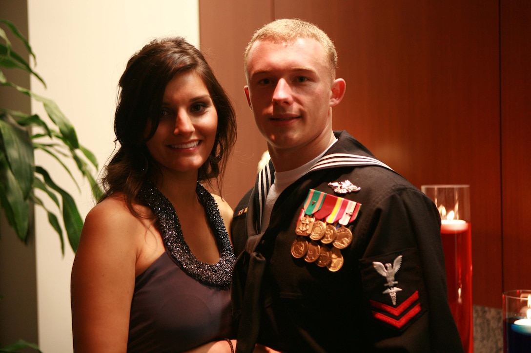 Petty Officer 2nd Class, Ryan Wayne Tilley, corpsman, Headquarters Battalion, 2nd Marine Division, and his girlfriend attend a USO of North Carolina banquet that celebrated the USO’s 70th anniversary at the Raleigh Convention Center, Raleigh, N.C., Oct. 7. The banquet honored servicemembers from all branches of the military.