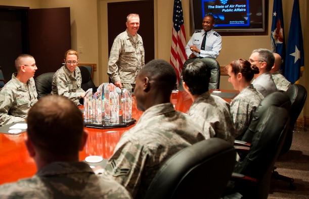 MCCONNELL AIR FORCE BASE, Kan. -- Col. Ricky Rupp, 22nd Air Refueling Wing commander, standing left, and Maj. Gen. Darren McDew, Air Force District of Washington commander, react while talking with public affairs and marketing specialists during a forum in McConnell Air Force Base’s wing conference room, Oct. 7, 2011.  Prior to attending McConnell’s Air Force Ball Oct. 7 as the keynote speaker, McDew visited with company grade officers, base commanders and chiefs, ALS students and future leaders to discuss his vision on leadership and communication.  (U.S. Air Force photo by Airman 1st Class Armando Schwier Morales)
