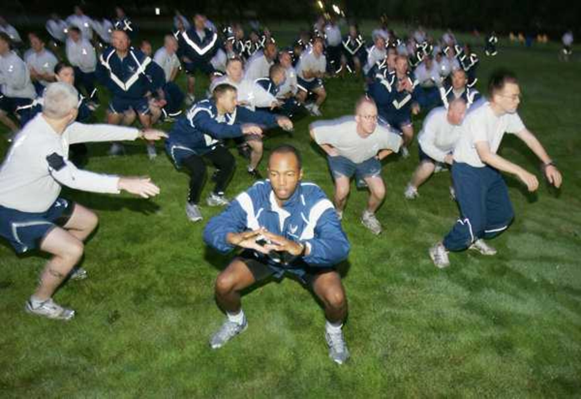 Air Force personnel perform exercises before participating in the Friday run September 30, 2011 on Joint Base Lewis-McChord, Wash. (Courtesy photo/David Poe)