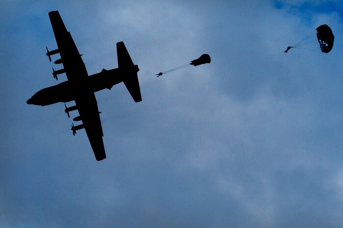 U.S. Air Force Airmen, 820th RED HORSE airborne flight, jump from a C-130 Hercules Oct. 4, 2011, at Nellis Air Force Base, Nev.  RED HORSE and 6th Combat Training Squadron Airmen perform airdrop missions to stay current on training and certifications, which enables them to perform jump missions and operate their own drop zones. (U.S. Air Force photo by Staff Sgt. William P. Coleman/Released)
  

