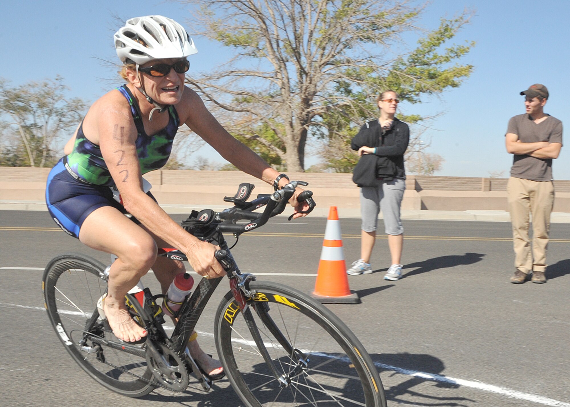 KIRTLAND AFB, N.M. -- Kathryn Aguilar bikes during the Warrior Triathlon on Oct. 1 at
Kirtland AFB. She finished 21st overall and first in the 65-69 age group, with a time of 1 hour, 47 minutes, 49.6 seconds. (Photo by Todd Berenger)