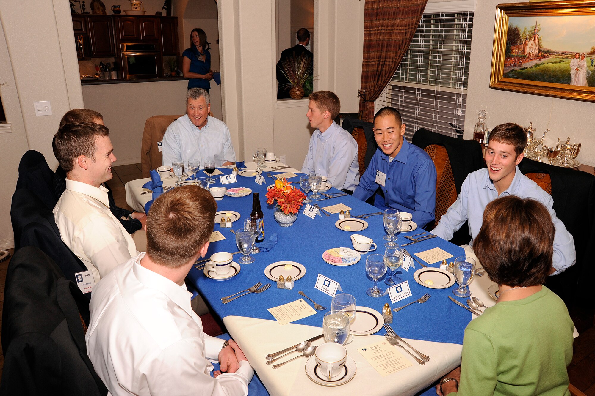 Mobilization Assistant to the Superintendent Brig. Gen. Cathy Chilton, and retired Col. Mick Erdle, president of the Academy Research and Development Institute, both sitting at opposite ends of the table, talk with cadets during the Aces dinner, Sept. 28. (U.S. Air Force Photo/Sarah Chambers)