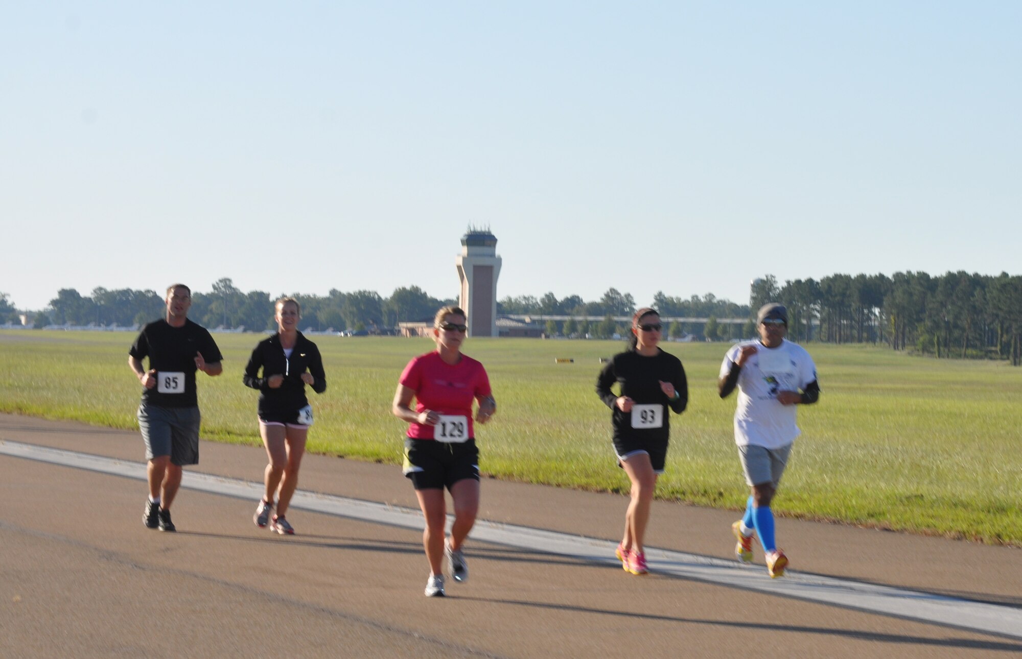 Participants of the BLAZE race on Oct. 1 run down the flightline as part of the course. Sixty-eight Team BLAZE members participated overall. Top 5k Male: Justin Lane. 5k Female: Elizabeth Poeppleman. Top 10k Male: Michael Fleharty. Top 10k Female: Megan Olsen. (U.S. Air Force photo/2nd Lt. Brionna Ruff)