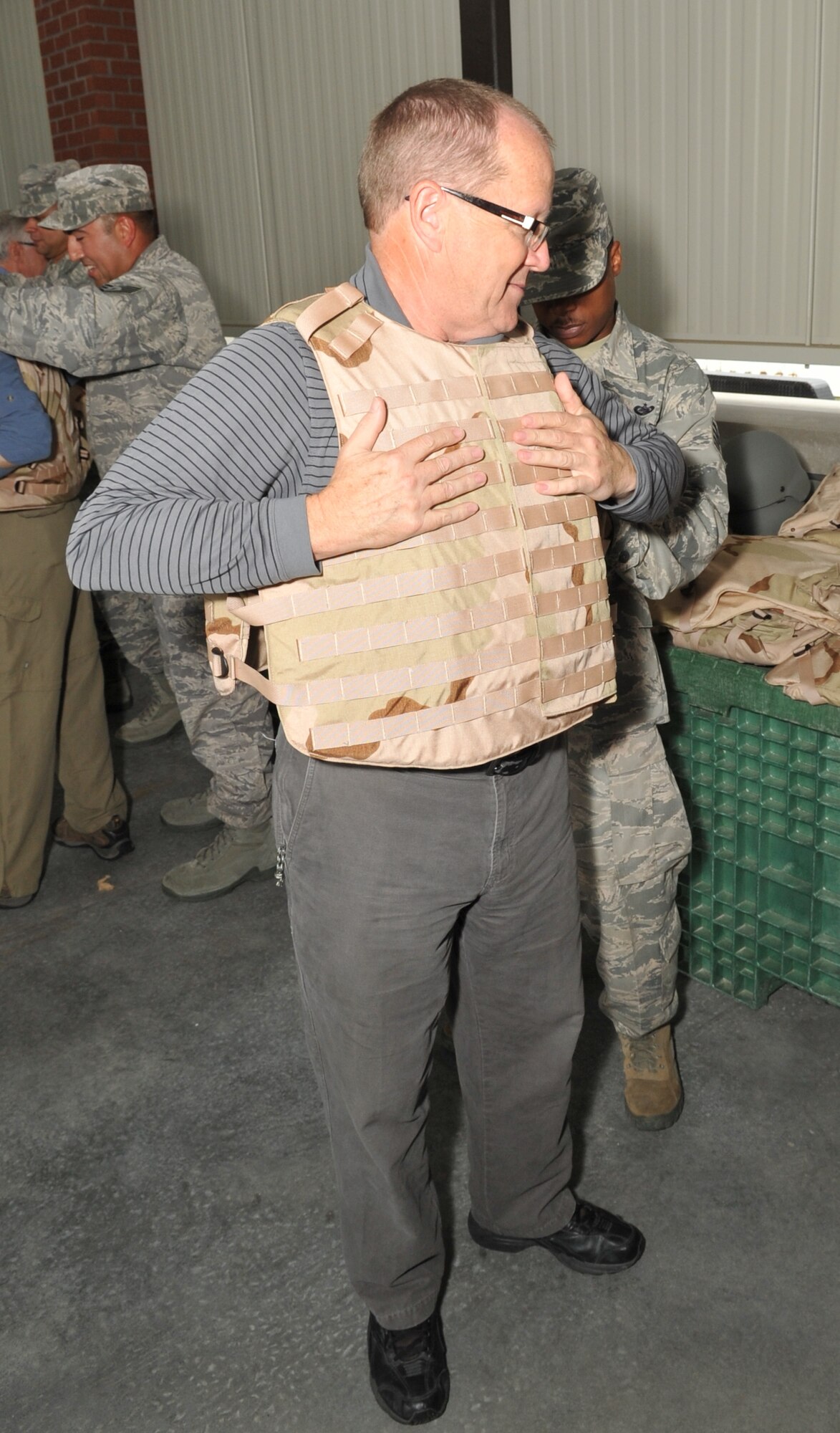 Don Fisk, Grand Forks civic leader, is fitted with protective gear during a recent visit to the U.S. Air Force Expeditionary Center, Joint Base McGuire-Dix-Lakehurst, N.J.  Fisk is part of the Air Mobility Command Civic Outreach program designed to acquaint civic leaders with the Air Mobility Command mission. (U.S. Air Force Photo by Mr. Charles W. Russell Jr.)