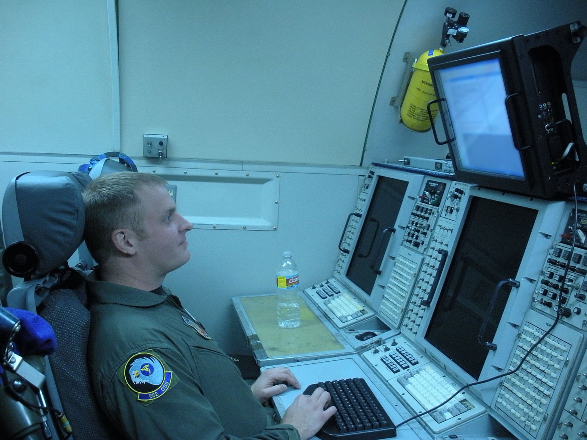 An AWACS crew member reviews incoming data. A team from the Electronic Systems Center has recently been working to get new capabilities that users have requested onto the AWACS platform. (Courtesy photo)