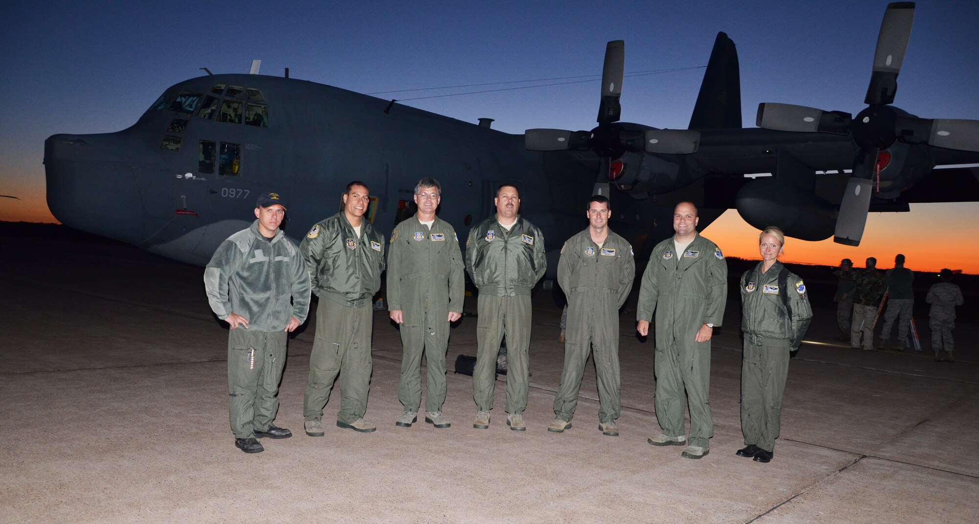 SUMMERSIDE, PRINCE EDWARD ISLAND, Canada - The crew of the WC-130J Hercules aircraft stands in front of the C-130 while the sun sets. A full team of Rescue Airmen including aircrew, maintenance and support crew members put their skills to work during the U.S. and Canadian Search and Rescue Exercise (SAREX) here. The 920th trains and equips approximately 1,500 Airmen to search for, locate and recover U.S. Armed Forces personnel during military operations. (U.S. Air Force photo/Capt. Cathleen Snow)