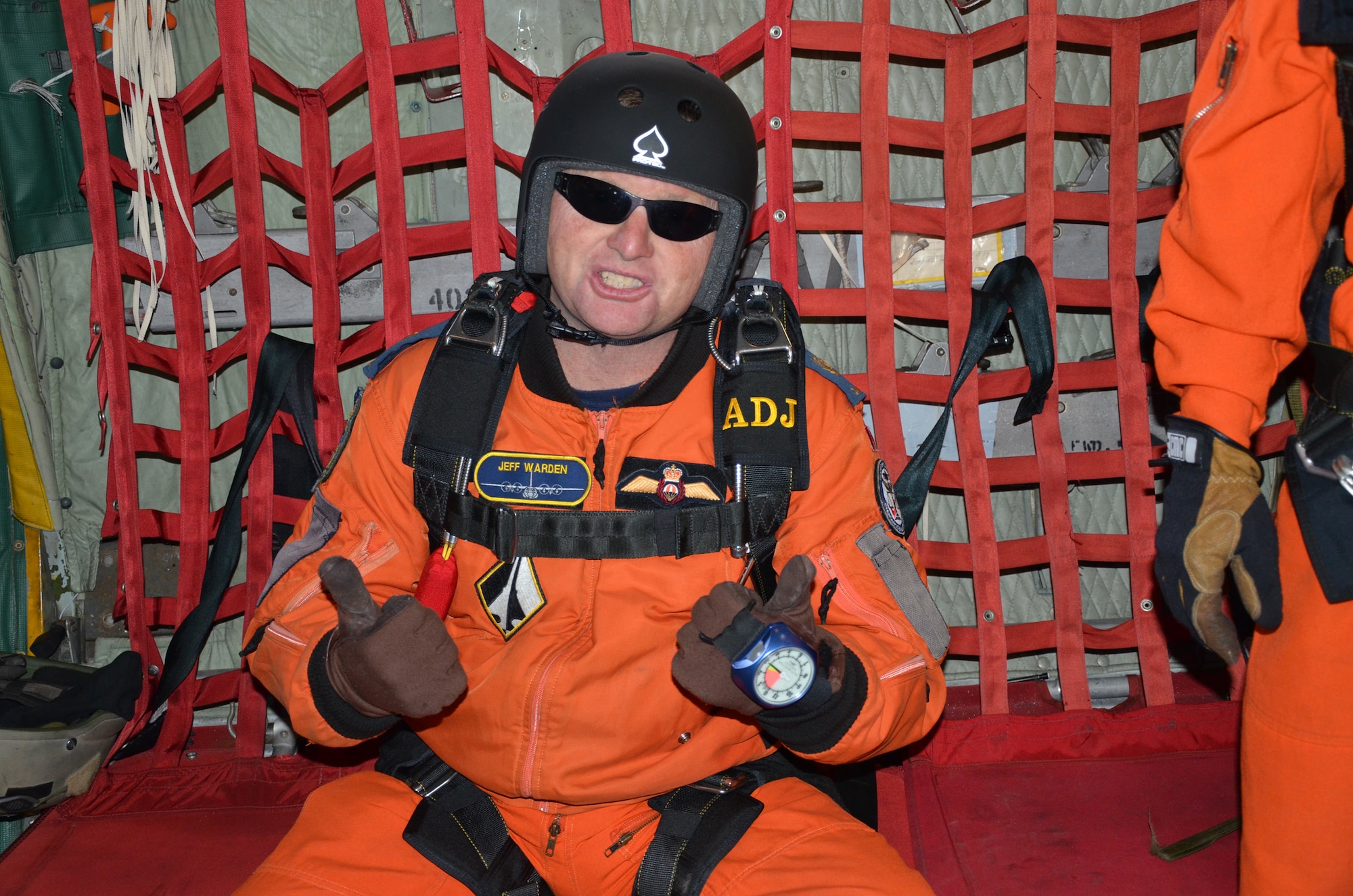 SUMMERSIDE, PRINCE EDWARD ISLAND, Canada- A Canadian Search and Rescue Technician (SARTech) gives two thumbs up moments before leaping off the back of WC-130J Hercules aircraft here. Canadian SAR forces respond to an average of 6-7 civilian distress calls per week. SARTechs and U.S. Air Force pararescuemen participated in various exercises during the week long U.S. and Canadian Search and Rescue Exercise (SAREX). (U.S. Air Force photo/Capt. Cathleen Snow)