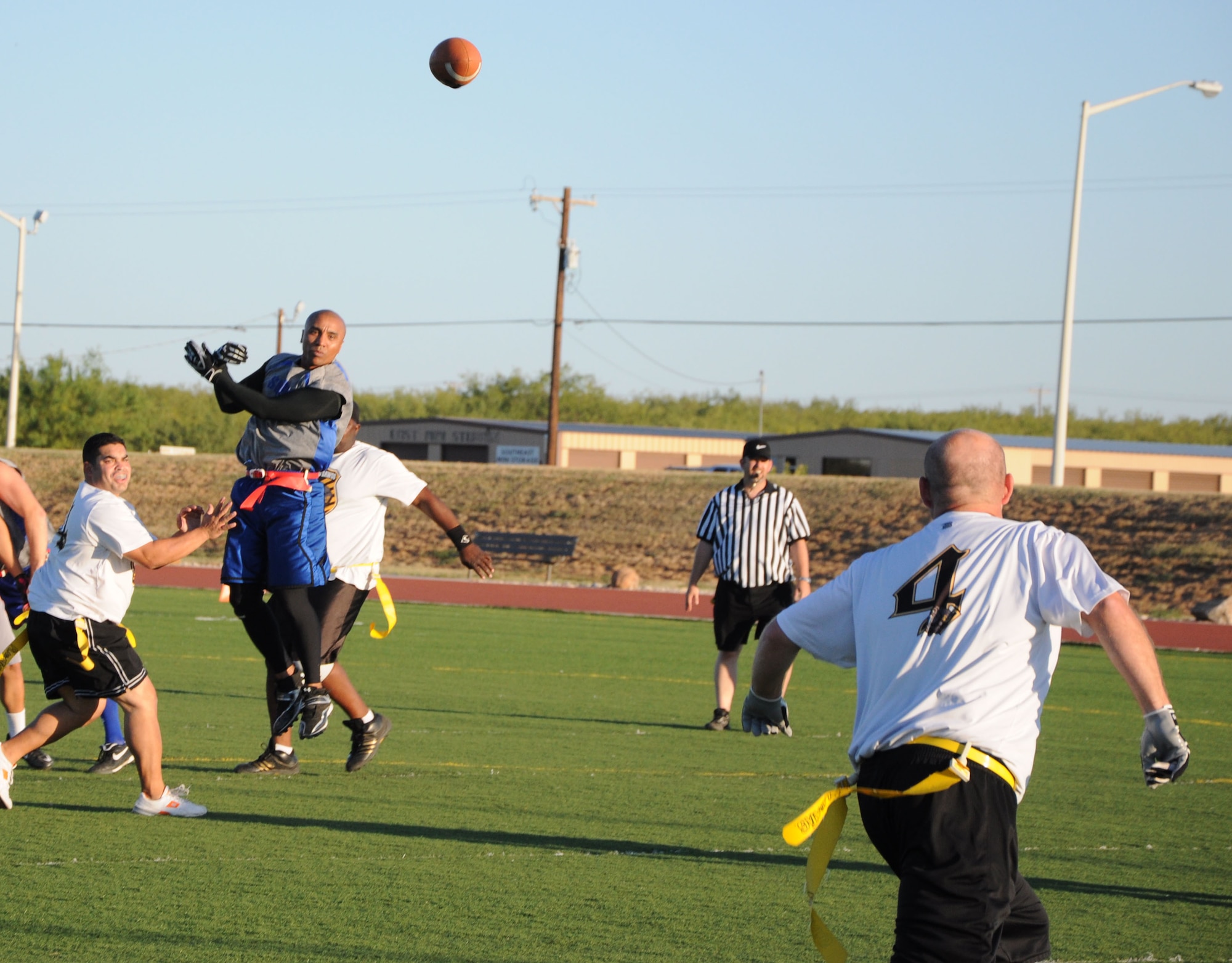GOODFELLOW AIR FORCE BASE, Texas--  A member of the 316th Training Squadron’s flag football team, the Sharks misses an interception as the ball heads to a Mission Support Group, Junkyard Dawgs player Oct. 6 at Mathis Field. The Junkyard Dawgs beat the Sharks 19:0, taking home the season’s championship. (U.S. Air Force photo/Airman 1st Class Jessica Keith)