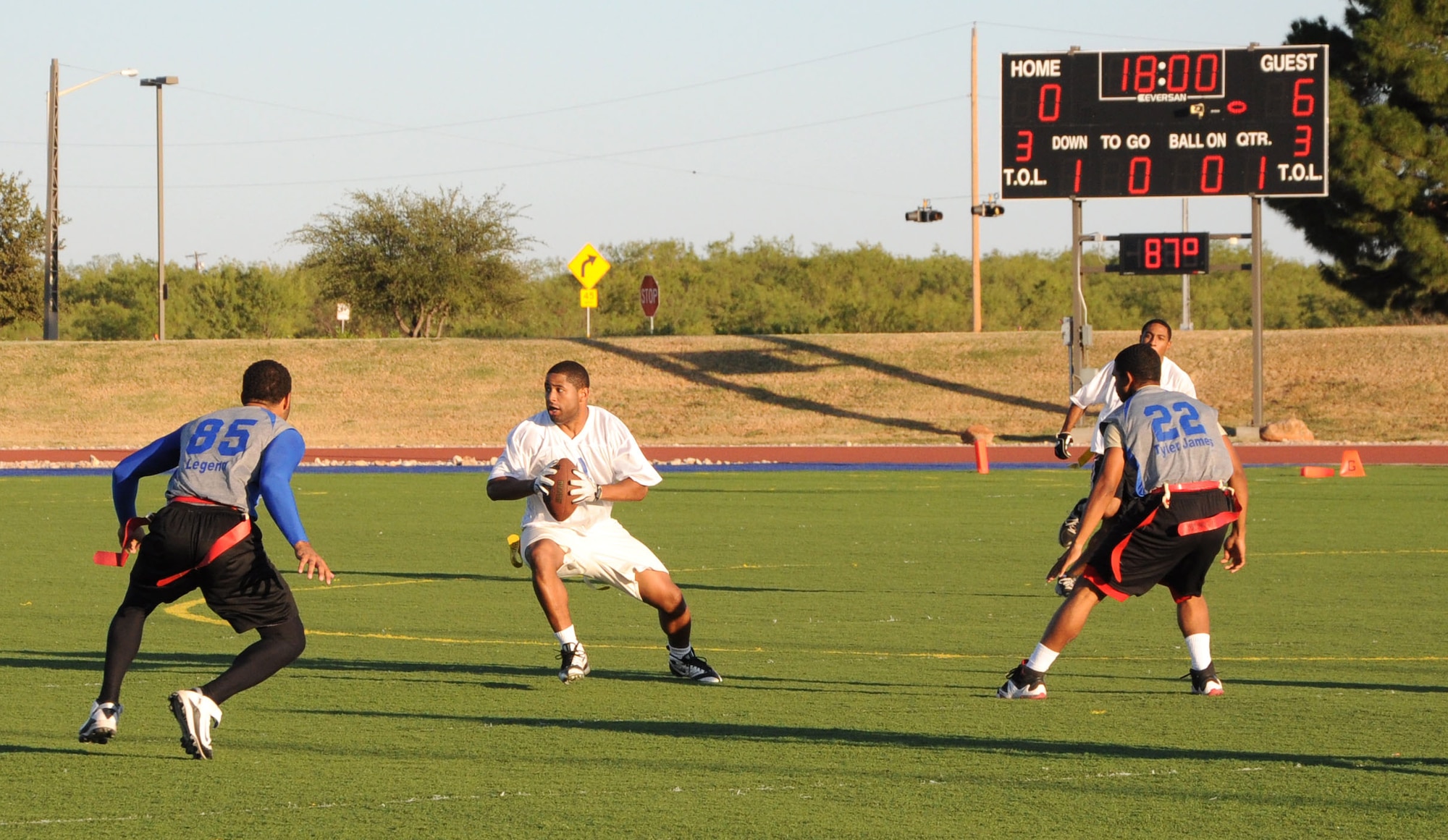 GOODFELLOW AIR FORCE BASE, Texas--  Clifton Gathers, from the 17th Comptroller Squadron and member of the Mission Support Group’s flag football team, the Junkyard Dawgs, dodges defenders from the 316th Training Squadron’s team, the Sharks, Oct. 6 at Mathis Field. The Junkyard Dawgs beat the Sharks 19:0, taking home the season’s championship. (U.S. Air Force photo/Airman 1st Class Jessica Keith)