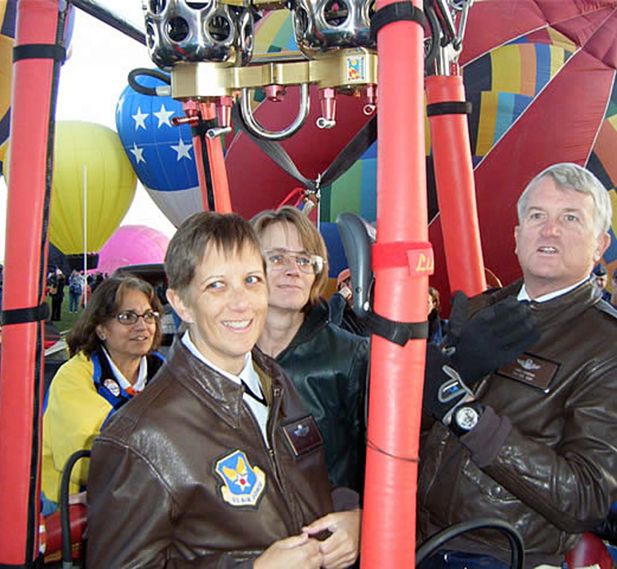 Air Force Operational Test and Evaluation Center’s Col. Erin Skowran and her sister Maurreen Skowran get ready for lift off in the Marauder’s Mark balloon piloted by AFOTEC Commander Maj. Gen. David J. Eichhorn following her Oct. 3 promotion ceremony at the Albuquerque International Balloon Fiesta launch site. (U.S. Air Force photo/Karl Gillium)