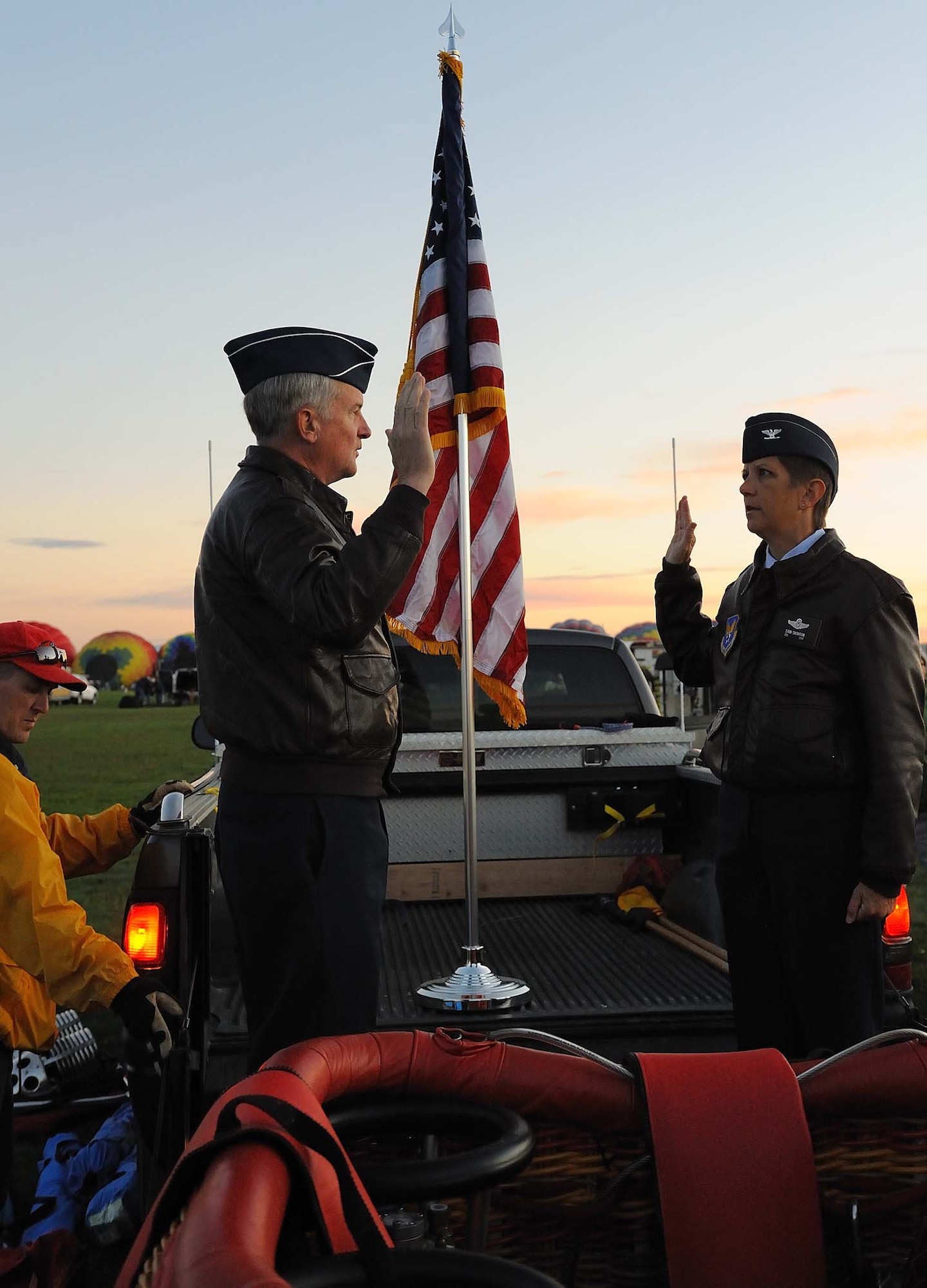 Maj. Gen. David J. Eichhorn, Air Force Operational Test and Evaluation Center Commander, administers the oath of office to Col. Erin Skowran during an Oct. 3 promotion ceremony at the Albuquerque International Balloon Fiesta. General Eichhorn, Colonel Skowran, and her sister Maurreen Skowran lifted off in the Marauder’s Mark balloon, piloted by the general, following the ceremony. (U.S. Air Force photo/Capt. Alan Louie)