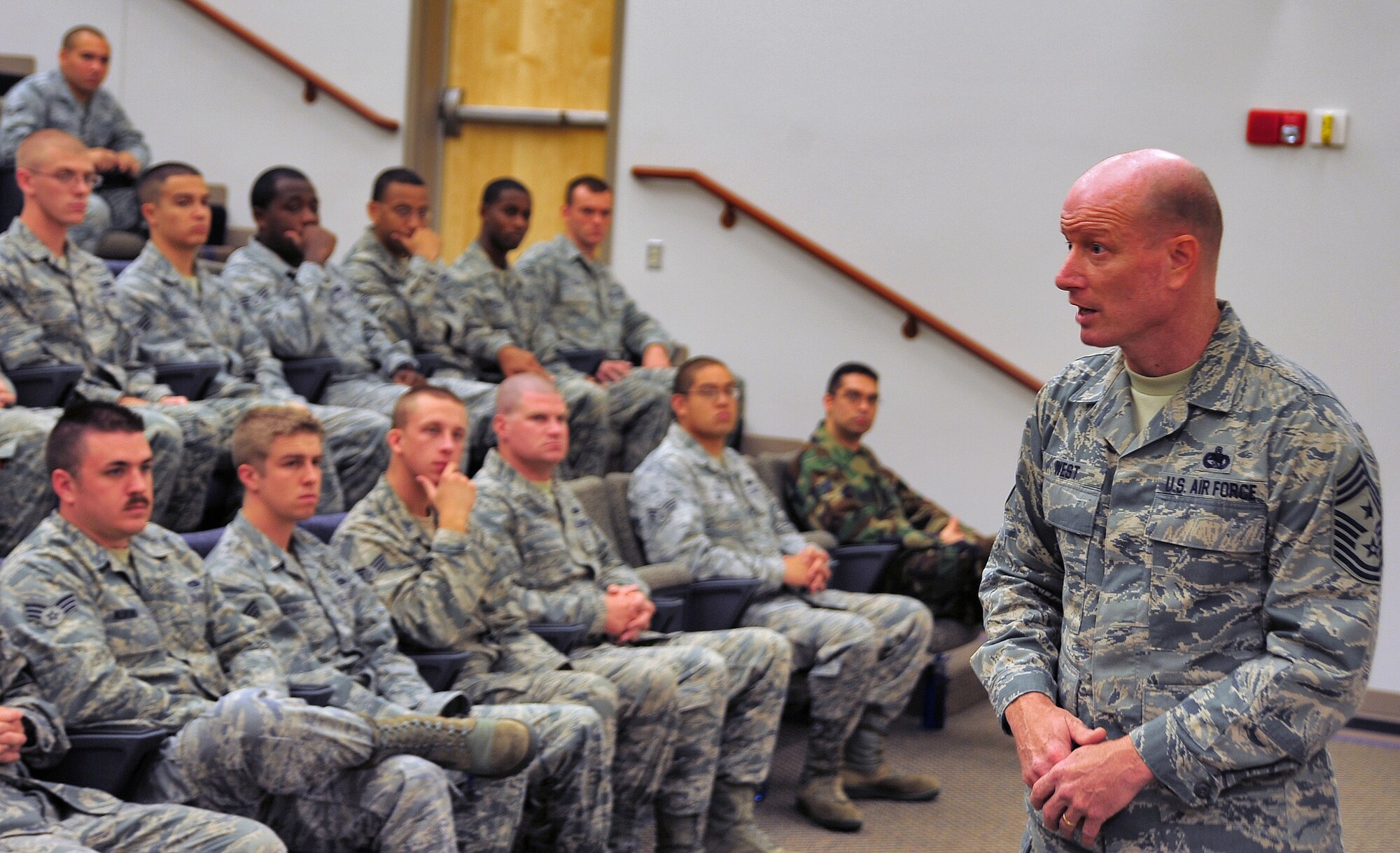 Chief Master Sgt. Terry West, 8th Air Force command chief, speaks to Airmen from the Whiteman Air Force Base's Airmen Leadership School at the Professional Development Center during a base visit Oct 4. West visited various locations around the 509th Bomb Wing to get a general understanding of the wing's mission and priorities. (U.S. Air Force photo/Senior Airman Nick Wilson)