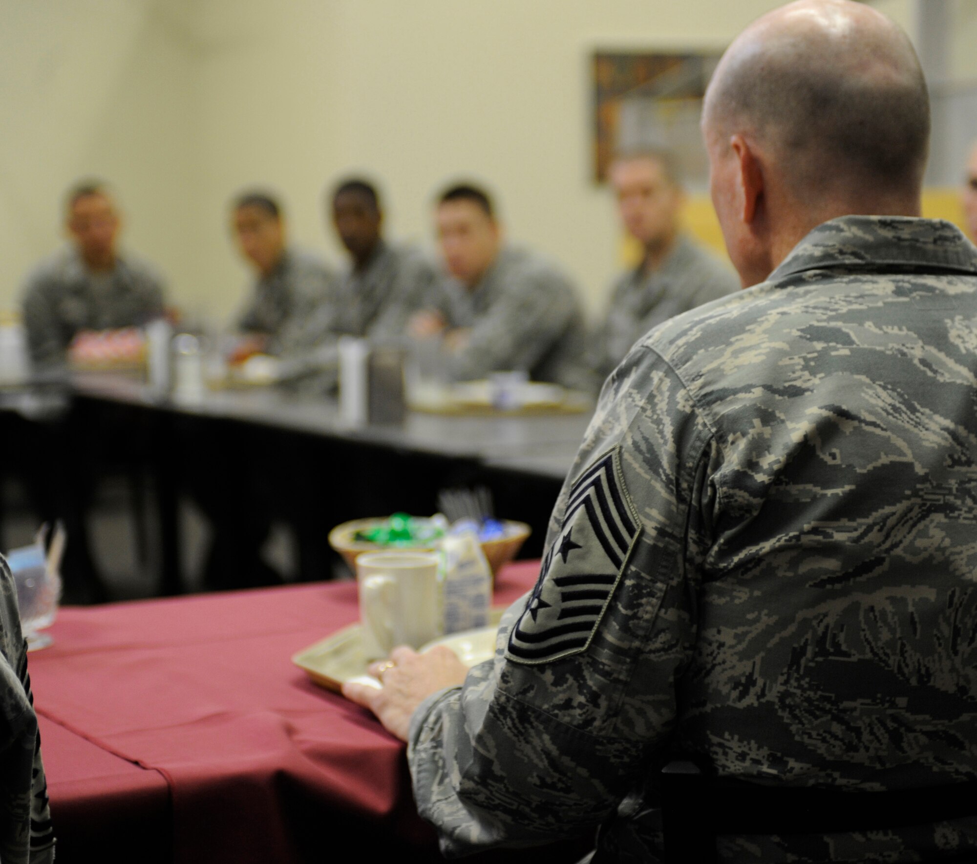 Chief Master Sgt. Terry West, 8th Air Force command chief, speaks to Airmen here, Oct. 5 during breakfast.  The chief answered several important career questions.  West visited with the First Term Airman Center, Airman Leadership School students, took a tour on the flightline and met with enlisted and officer medical professionals at the clinic to observe how Whiteman Airmen perform their mission first-hand. (U.S. Air Force photo by Staff Sgt. Alexandra M. Boutte) (RELEASED)