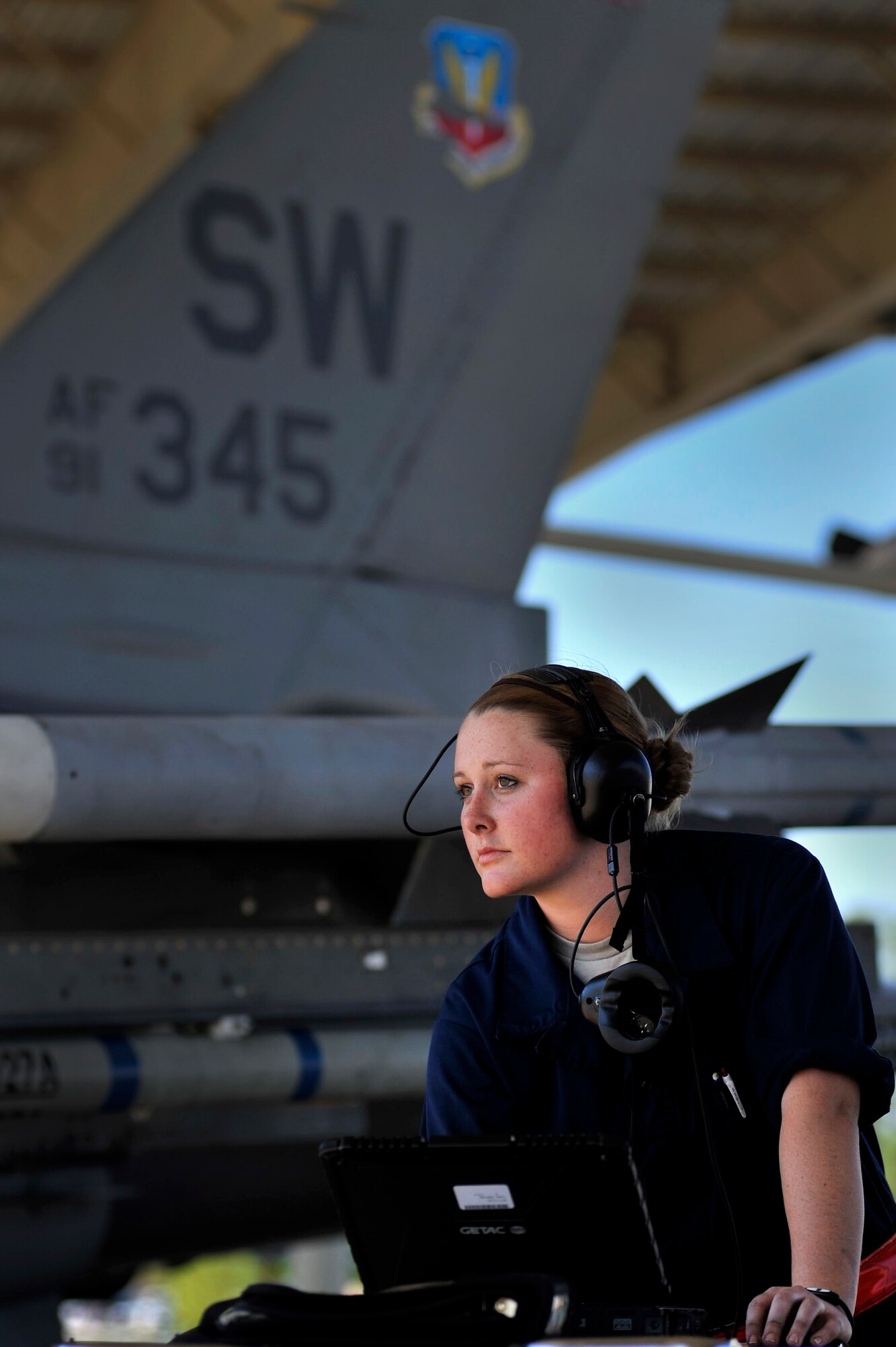 U.S. Air Force Airman 1st Class Erica Sanicky, 77th Fighter Squadron crew chief, completes her pre-flight checks prior to launching an F-16 Fighting Falcon, Oct. 5, 2011, Shaw Air Force Base, S.C. Sanicky and other 77th crew chiefs launched several F-16s to help pilots prepare for real world missions. (U.S. Air Force photo by Senior Airman Kenny Holston/Released)


