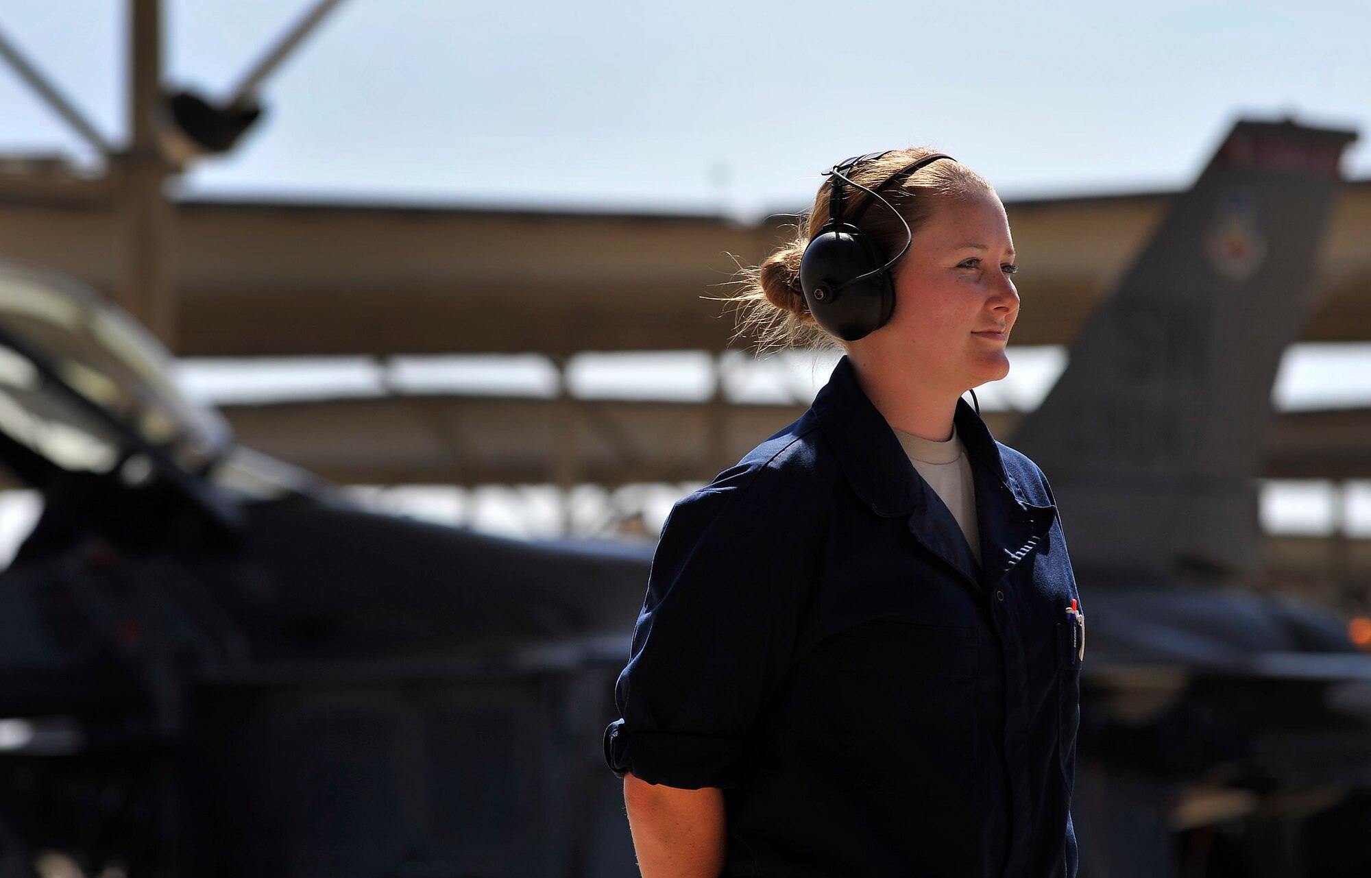U.S. Air Force Airman 1st Class Erica Sanicky, 77th Fighter Squadron crew chief, stands in position in preparation to launch an F-16 Fighting Falcon, Oct. 5, 2011, Shaw Air Force Base, S.C. Sanicky and other 77th crew chiefs launched several F-16s to help pilots prepare for real world missions. (U.S. Air Force photo by Senior Airman Kenny Holston/Released)


