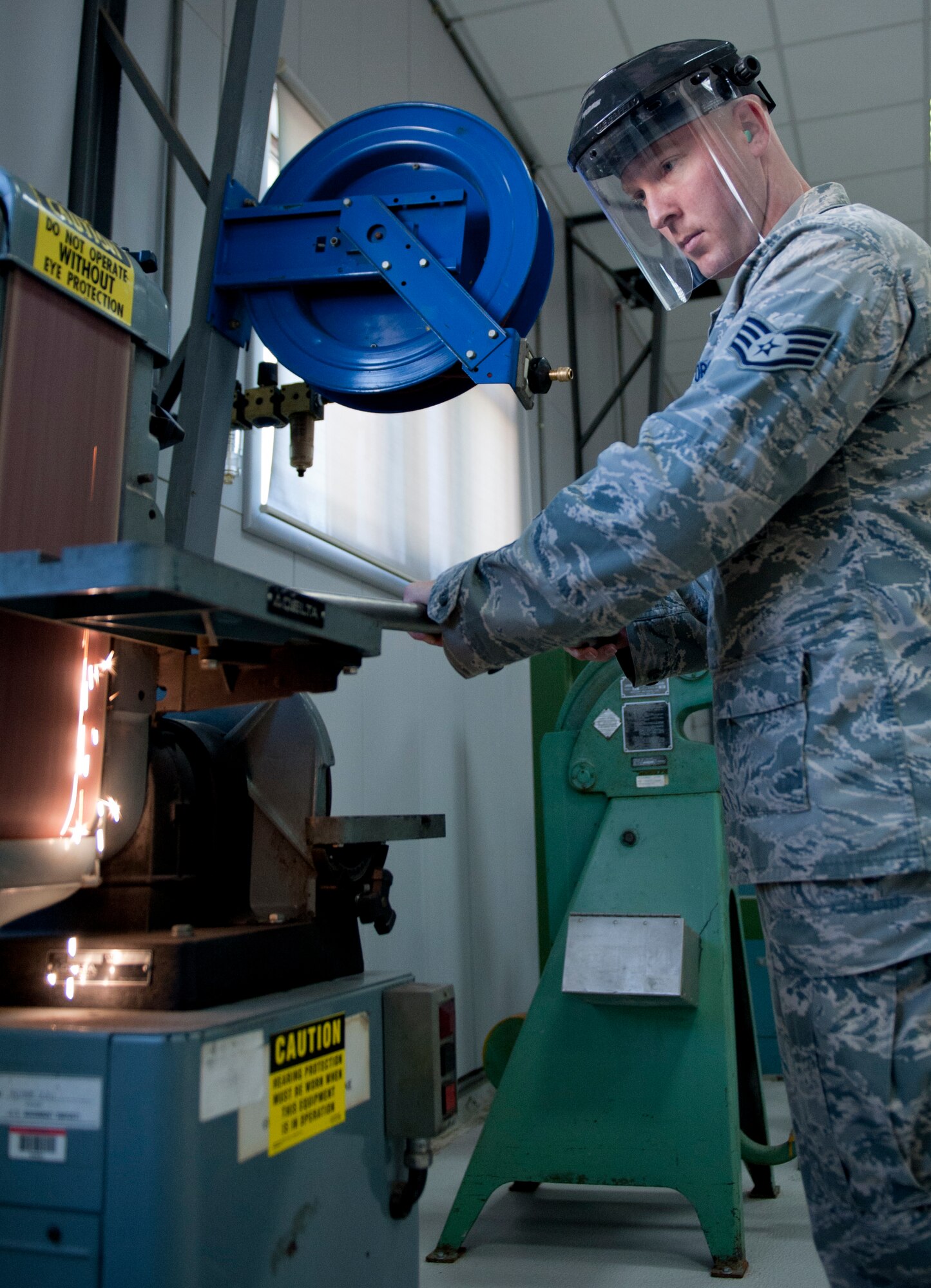 Staff Sgt. Robby Worley, 39th Maintenance Squadron aircraft structural maintenance craftsman, grinds a pipe on a belt sander Oct. 4, 2011, at Incirlik Air Base, Turkey. The maintenance squadron is responsible for welding and sheet metal fixes, directing aircraft to where it will be parked, crash response capabilities, providing lighting and generators, and many other duties. The 39th MSX works as a back shop for the 728th Air Mobility Squadron’s maintainers.(U.S. Air Force photo by Senior Airman Anthony Sanchelli/Released)