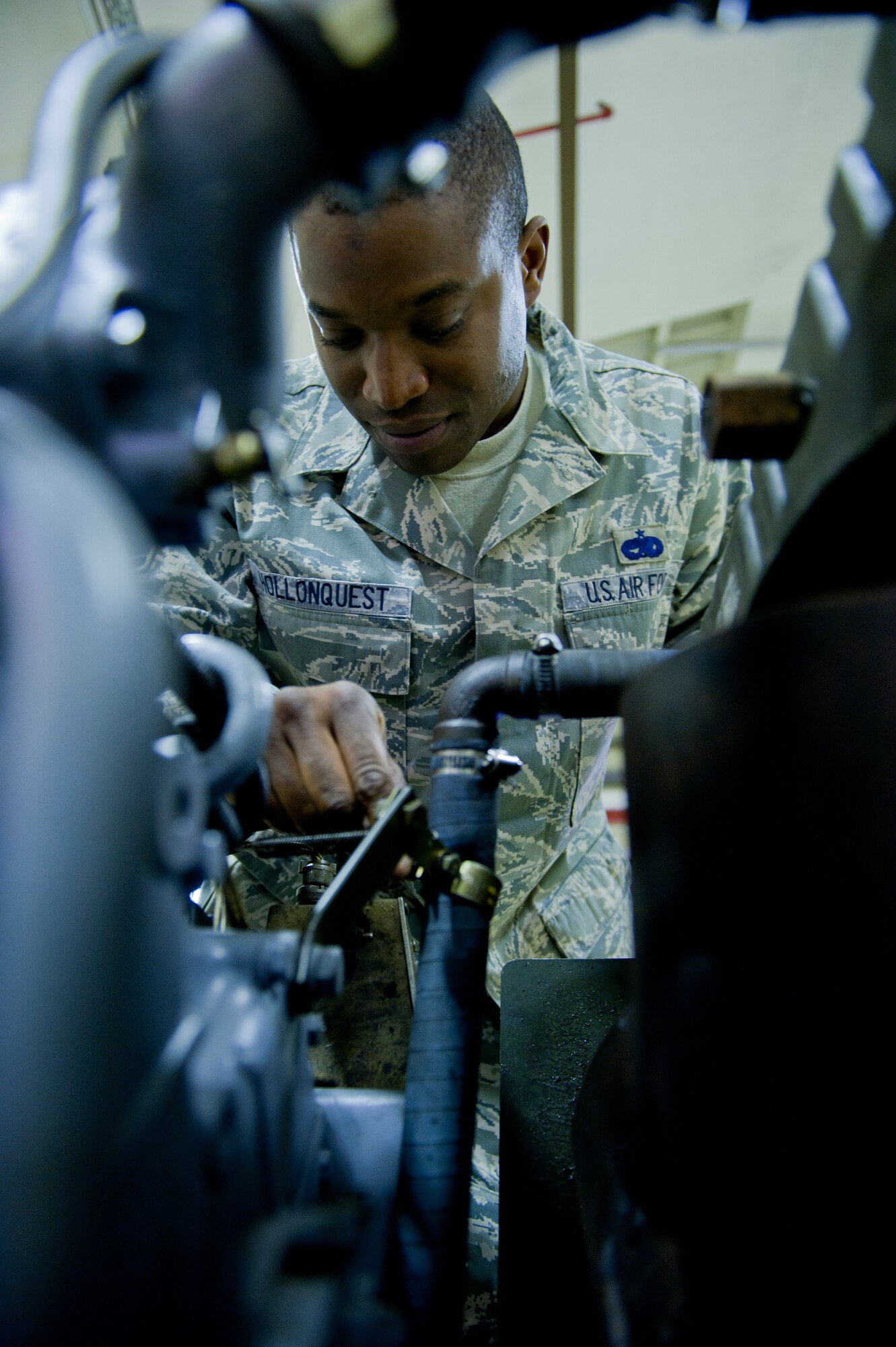 Staff Sgt. Clifton Hollonquest, 39th Maintenance Squadron aerospace ground equipment craftsman, inspects a new generator engine Oct. 4, 2011, at Incirlik Air Base, Turkey. The maintenance squadron is responsible for welding and sheet metal fixes, directing aircraft to where it will be parked, crash response capabilities, providing lighting and generators, and many other duties. The 39th MSX works as a back shop for the 728th Air Mobility Squadron’s maintainers.(U.S. Air Force photo by Senior Airman Anthony Sanchelli/Released)
