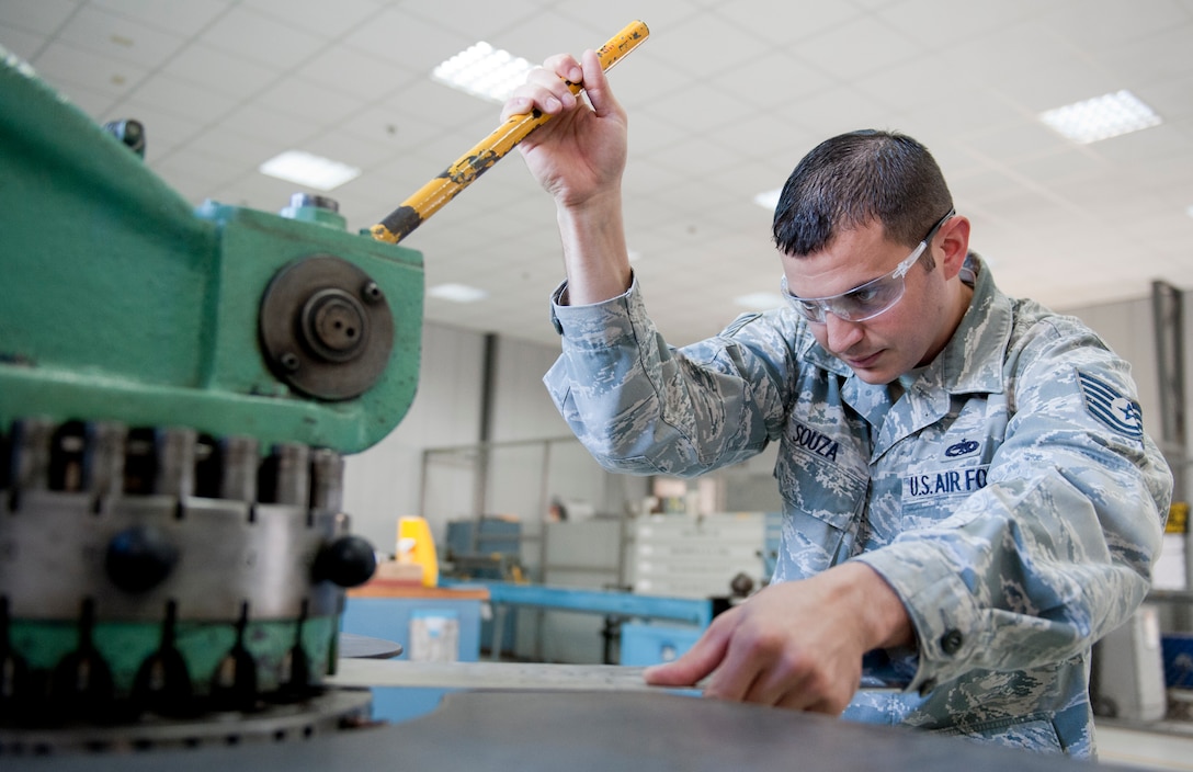 Tech. Sgt. Nicholas Souza, 39th Maintenance Squadron metals maintenance section chief, slides a sheet of metal into a rotex punch creating holes through the sheet Oct. 4, 2011, at Incirlik Air Base, Turkey. The maintenance squadron is responsible for welding and sheet metal fixes, directing aircraft to where it will be parked, crash response capabilities, providing lighting and generators, and many other duties. The 39th MSX works as a back shop for the 728th Air Mobility Squadron’s maintainers.(U.S. Air Force photo by Senior Airman Anthony Sanchelli/Released)