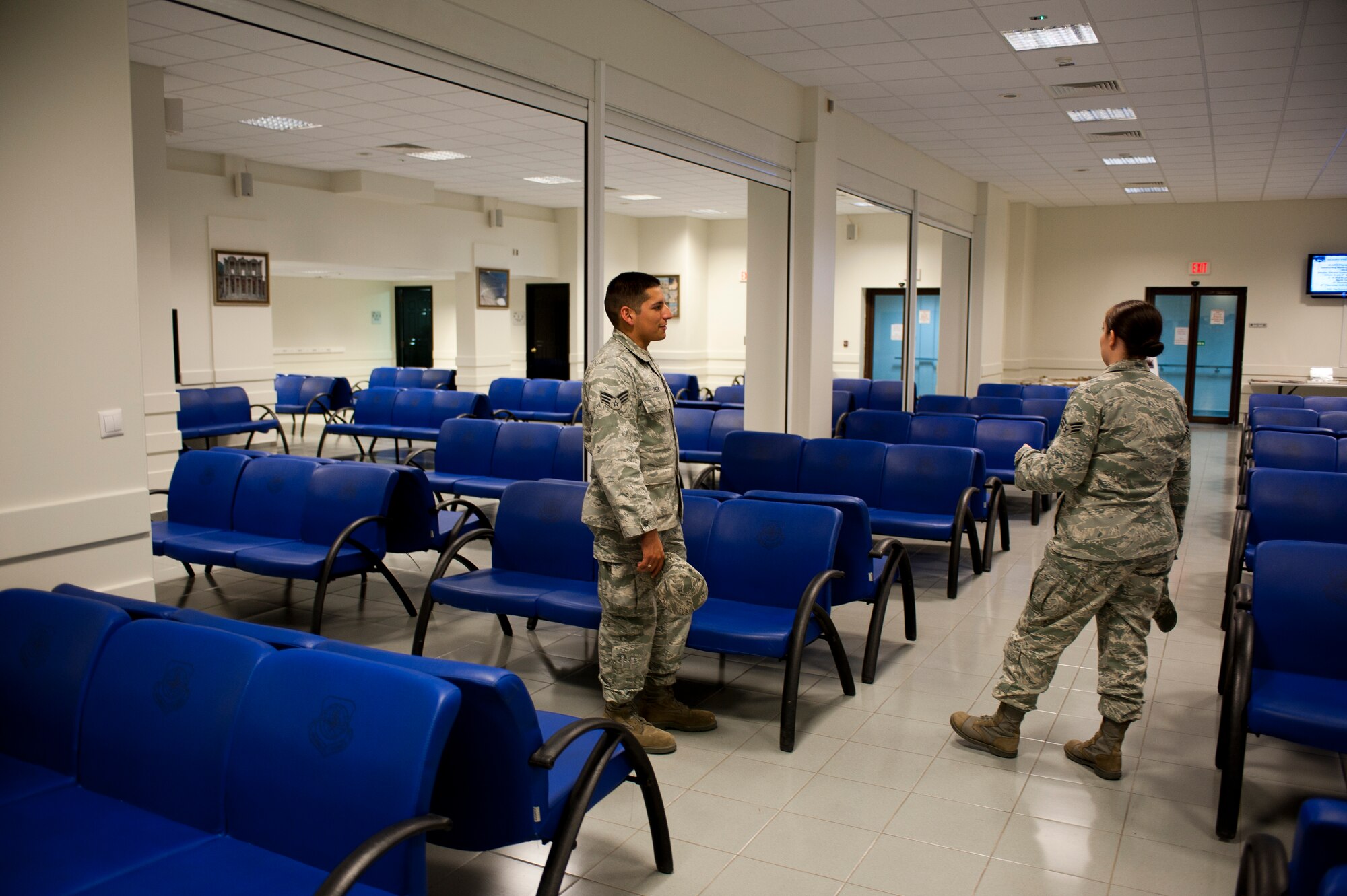 Senior Airmen Jorge Reza and Heather Durfy, 728th Air Mobility Squadron, tour the renovated Air Mobility Command Passenger Terminal Oct. 5, 2011, at Incirlik Air Base, Turkey. The improvements to the terminal include a new heating, ventilation and air conditioning system; a drop ceiling; improved lighting to increase interior luminosity; and updates to the family and special category lounges. The terminal was constructed in 1972, an automated conveyor belt was added in 1997 and an arrival terminal in 2004. (U.S. Air Force photo by Senior Airman Clayton Lenhardt/Released)