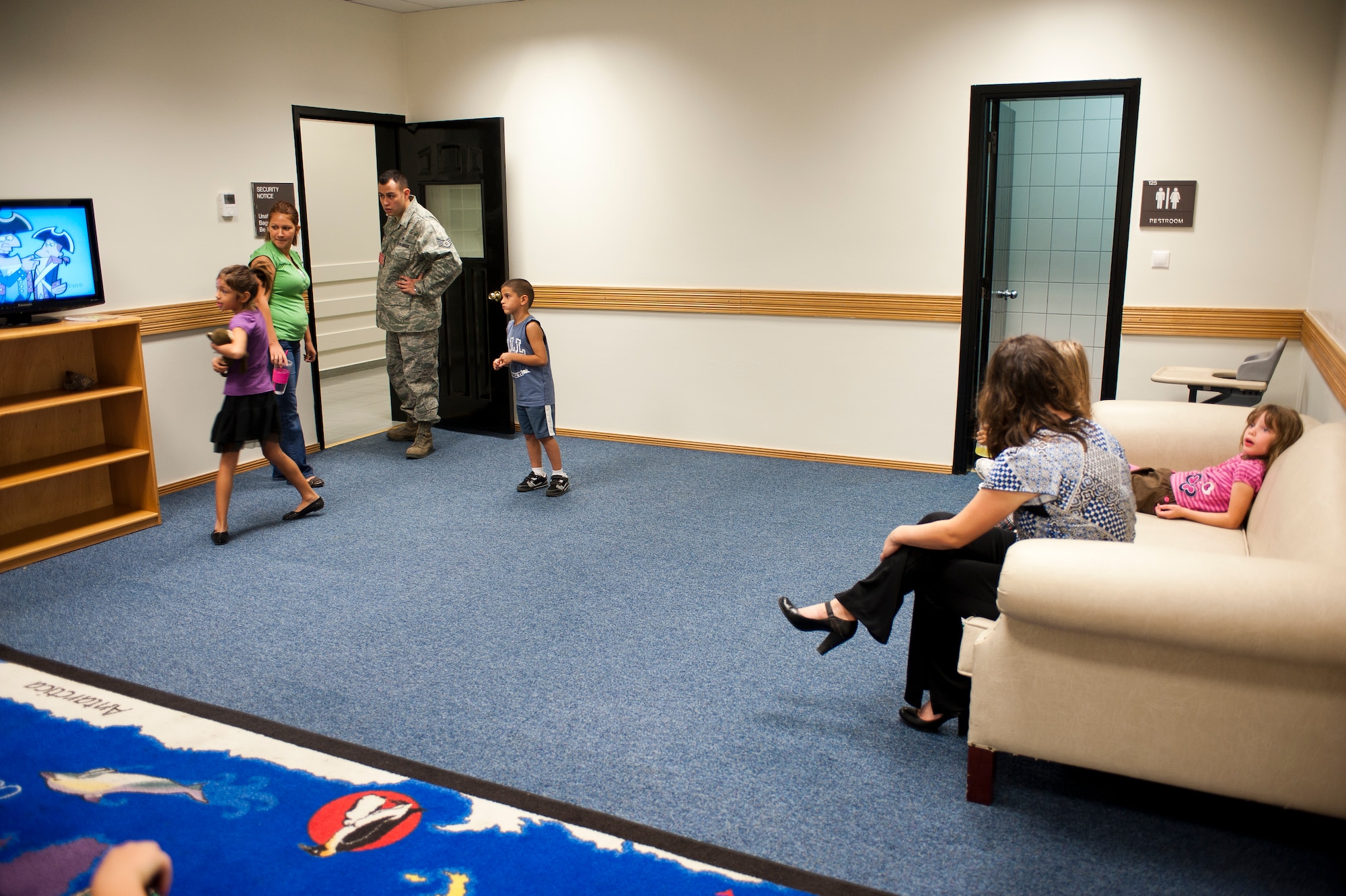 Members of Team Incirlik view the family lounge while touring the renovated Air Mobility Command Passenger Terminal Oct. 5, 2011, at Incirlik Air Base, Turkey. The improvements to the terminal include a new heating, ventilation and air conditioning system; a drop ceiling; improved lighting to increase interior luminosity; and updates to the family and special category lounges. The terminal was constructed in 1972, an automated conveyor belt was added in 1997 and an arrival terminal in 2004. (U.S. Air Force photo by Senior Airman Clayton Lenhardt/Released)
