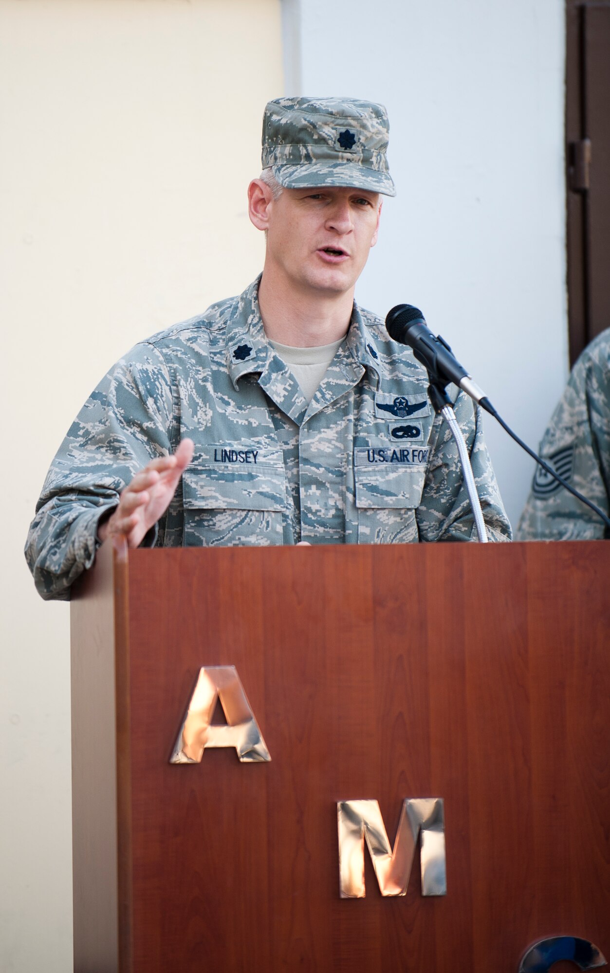 Lt. Col. Brian Lindsey, 728th Air Mobility Squadron commander, speaks during the Air Mobility Command Passenger Terminal ribbon cutting Oct. 5, 2011, at Incirlik Air Base, Turkey. The improvements to the terminal include a new heating, ventilation and air conditioning system; a drop ceiling; improved lighting to increase interior luminosity; and updates to the family and special category lounges. The terminal was constructed in 1972, an automated conveyor belt was added in 1997 and an arrival terminal in 2004. (U.S. Air Force photo by Senior Airman Clayton Lenhardt/Released)