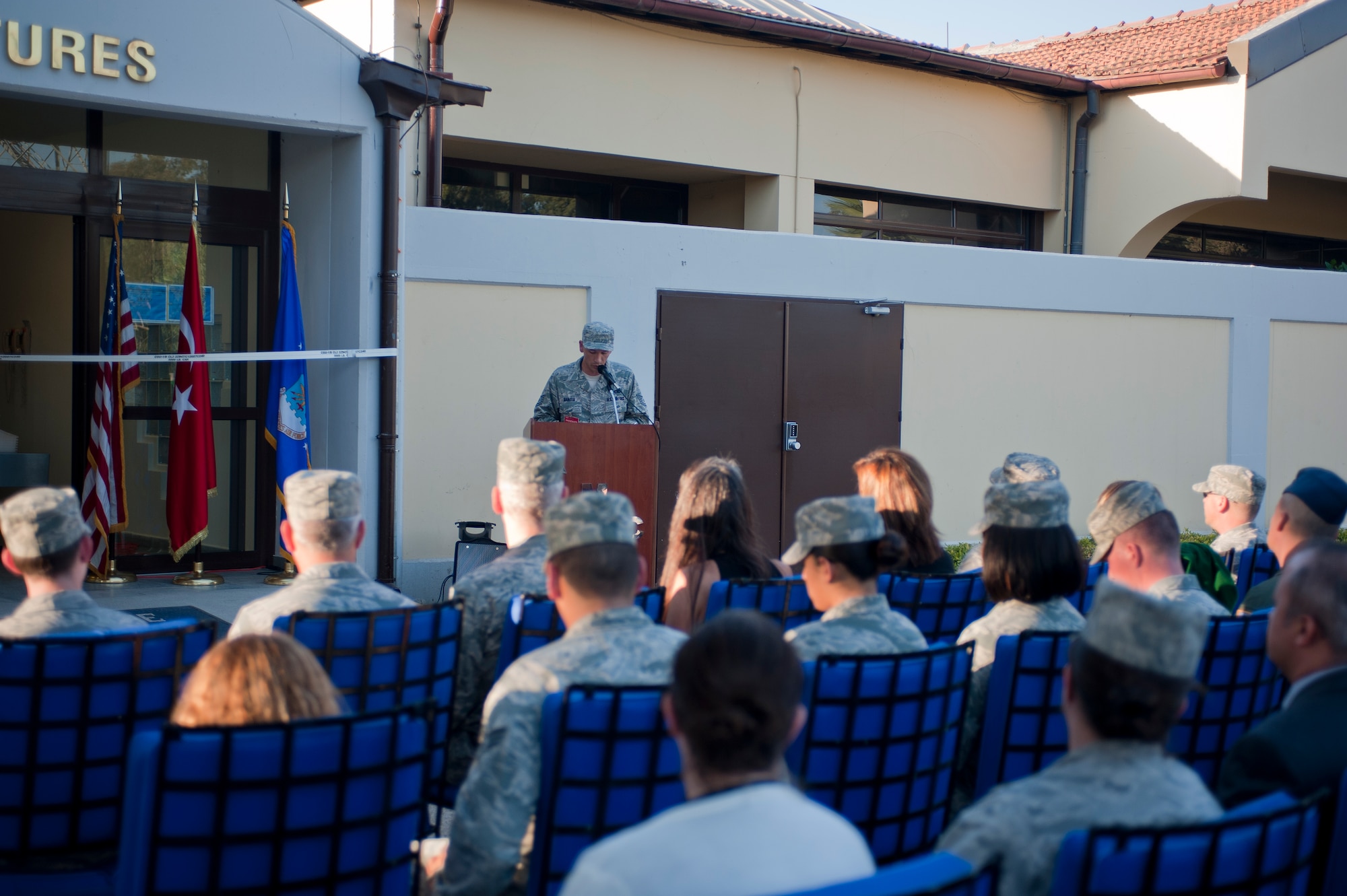 Airmen and their families gather for the reopening of the Air Mobility Command Passenger Terminal Oct. 5, 2011, at Incirlik Air Base, Turkey. The improvements to the terminal include a new heating, ventilation and air conditioning system; a drop ceiling; improved lighting to increase interior luminosity; and updates to the family and special category lounges. The terminal was constructed in 1972, an automated conveyor belt was added in 1997 and an arrival terminal in 2004. (U.S. Air Force photo by Senior Airman Clayton Lenhardt/Released)