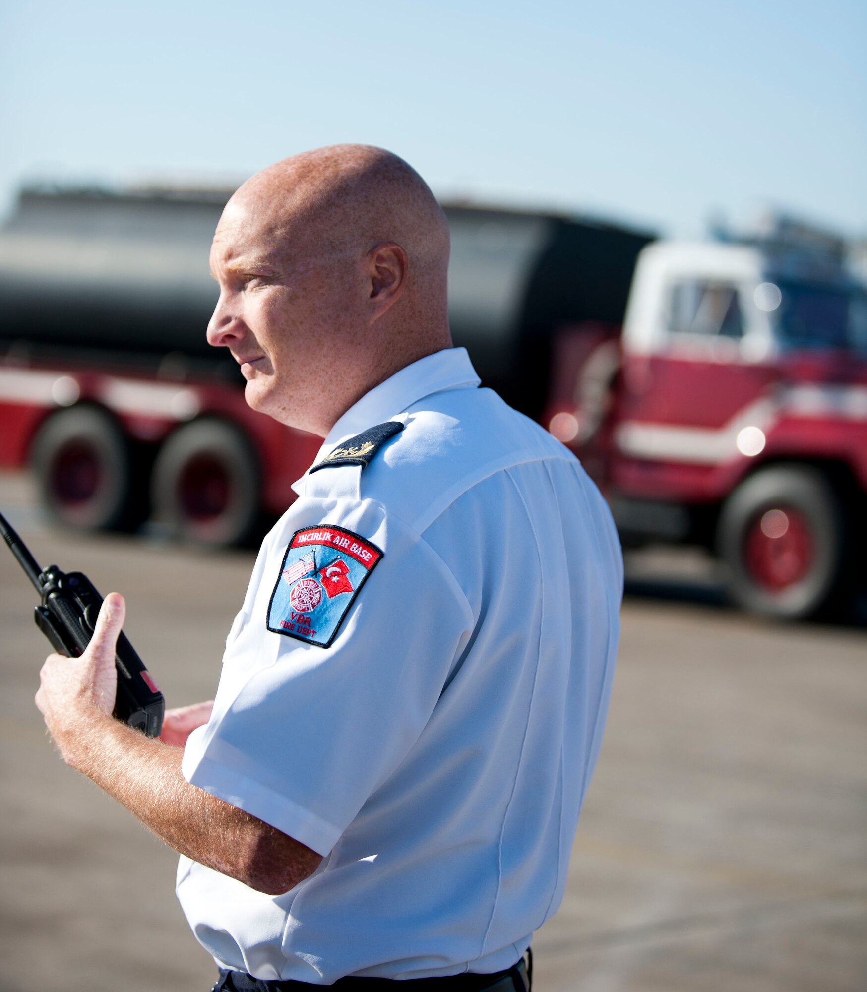 Ron Tanner, Incirlik Air Base assistant fire chief, acts as the on-scene commander at a simulated fuel spill during a fuel spill response exercise Oct. 5, 2011, at Incirlik Air Base, Turkey. The on-scene commander is the person designated to coordinate efforts at the scene of an incident. (U.S. Air Force photo by Senior Airman Clayton Lenhardt/Released)