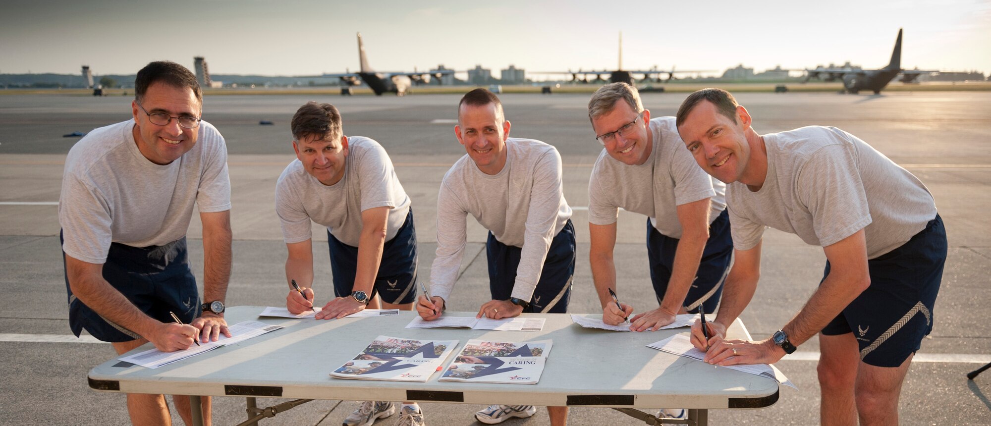 YOKOTA AIR BASE, Japan -- 374th Airlift Wing leadership sign the first donation forms for the 2011 Combined Federal Campaign at Yokota Air Base, Japan, Oct. 7, 2011. The CFC consolidates donations for more than 2,400 charities. (U.S. Air Force photo/Staff Sgt. Samuel Morse)