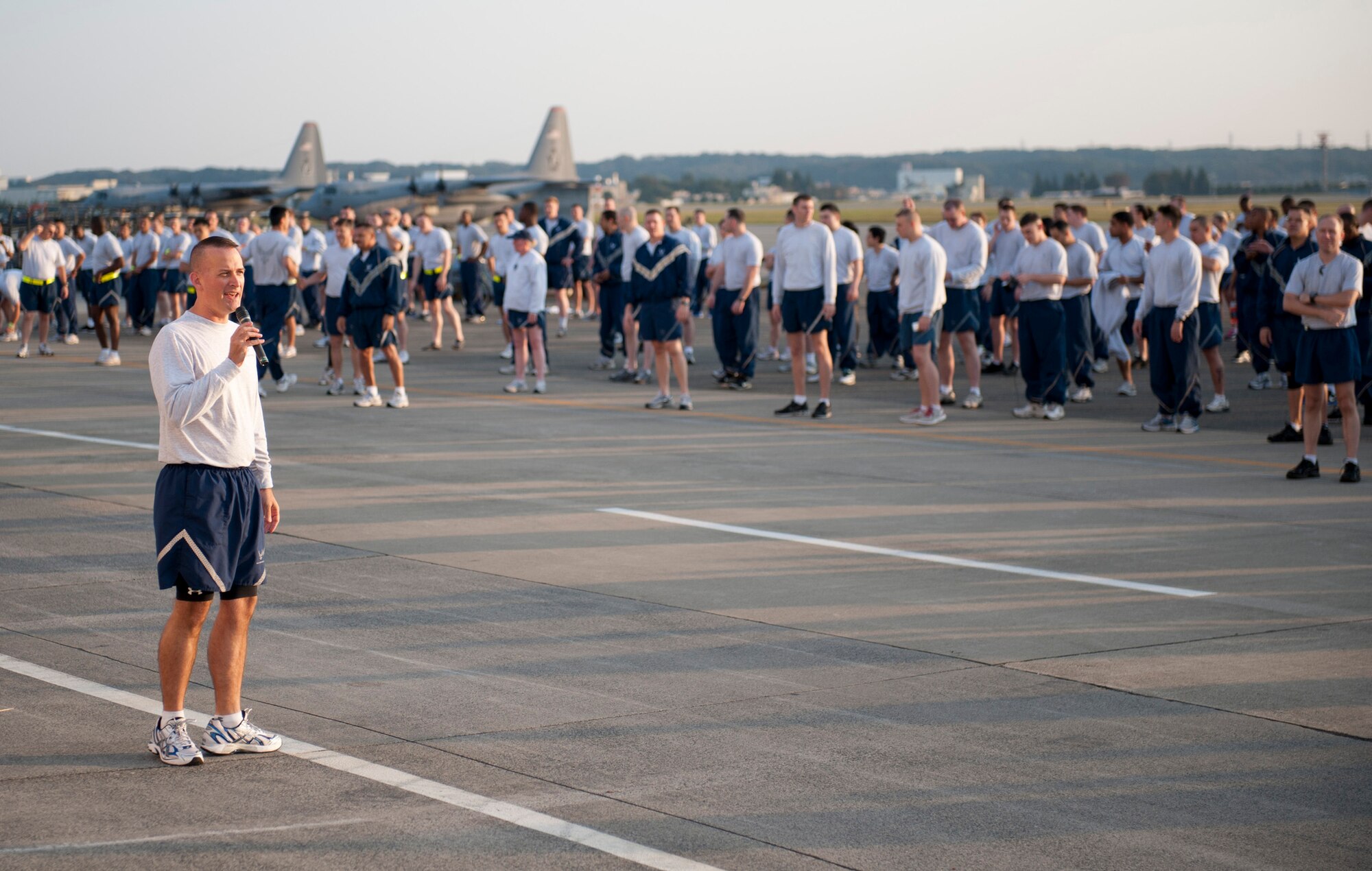 YOKOTA AIR BASE, Japan -- Col. Bill Knight, 374th Airlift Wing vice commander, gives a motivational speech prior to the wing run at Yokota Air Base, Japan, Oct. 7, 2011. Knight suggested that each Airman contribute to the Combined Federal Campaign, starting the very same day. (U.S. Air Force photo/Staff Sgt. Samuel Morse)