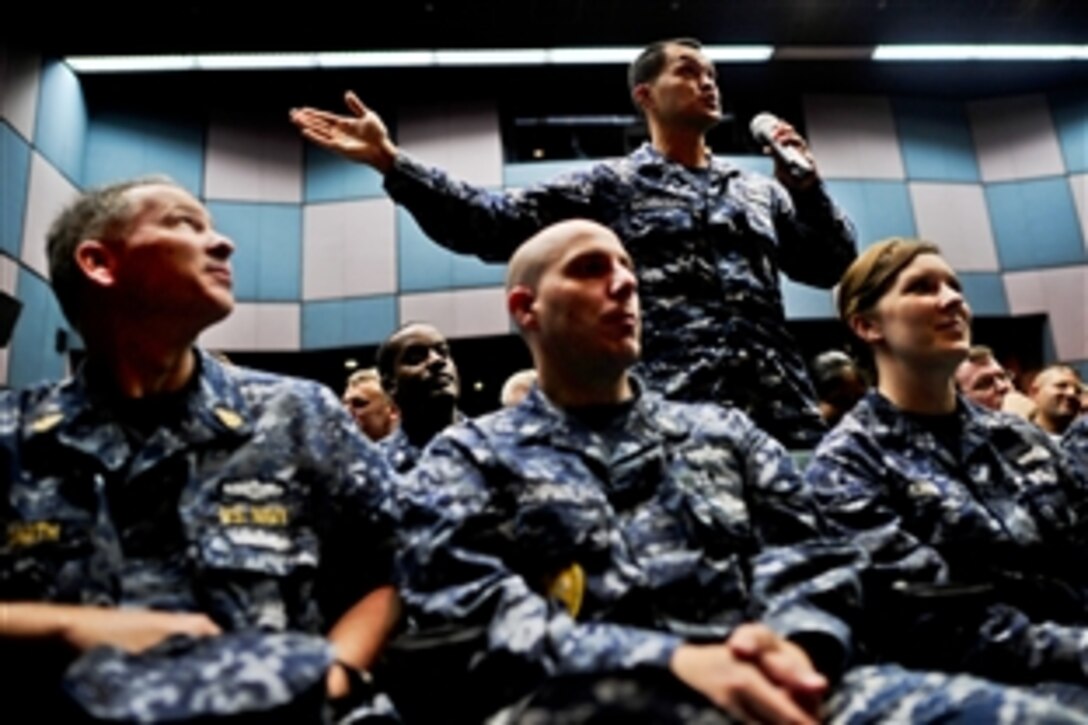 A U.S. sailor asks U.S. Defense Secretary Leon E. Panetta a question during his visit to U.S. troops on Naval Support Activity Naples, Italy, Oct. 7, 2011. Panetta thanked the troops for their service and answered questions from service members.