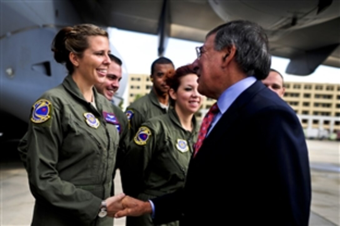 U.S. Defense Secretary Leon E. Panetta meets with U.S. Air Force C-17 crew members during Panetta's visit to Naval Support Activity Naples, Italy, Oct. 7, 2011. The crew members are assigned to the 1st Airlift Squadron, Andrews Air Force Base, Md.