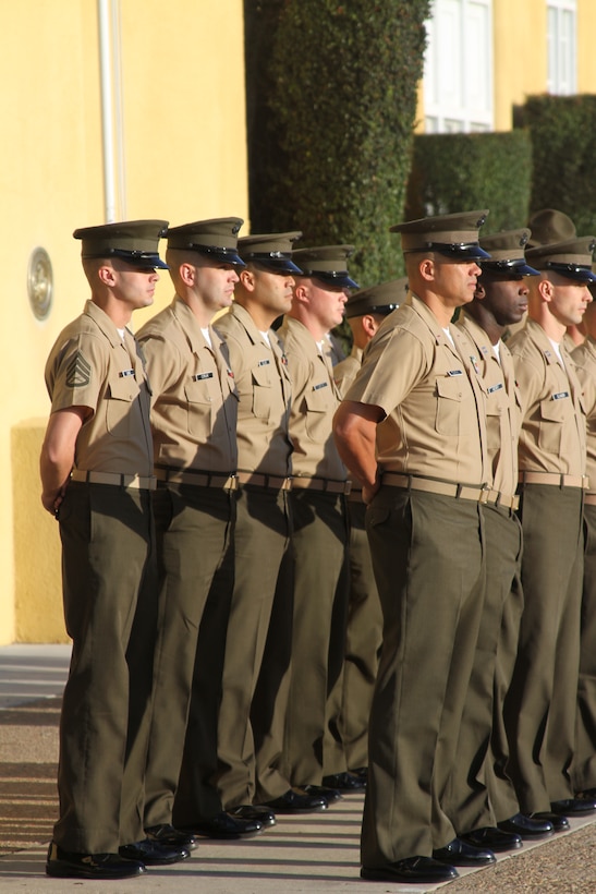 Marines from Headquarters and Service Battalion stand at parade rest in formation during the Morning Colors Ceremony Oct. 7. There are three different formations present at the ceremony, one from 12th Marine Corps District, Headquarters and Service Battalion and the Recruit Training Regiment. Each formation is present so that the families can put a face to the Marines who turned their son into a Marine.