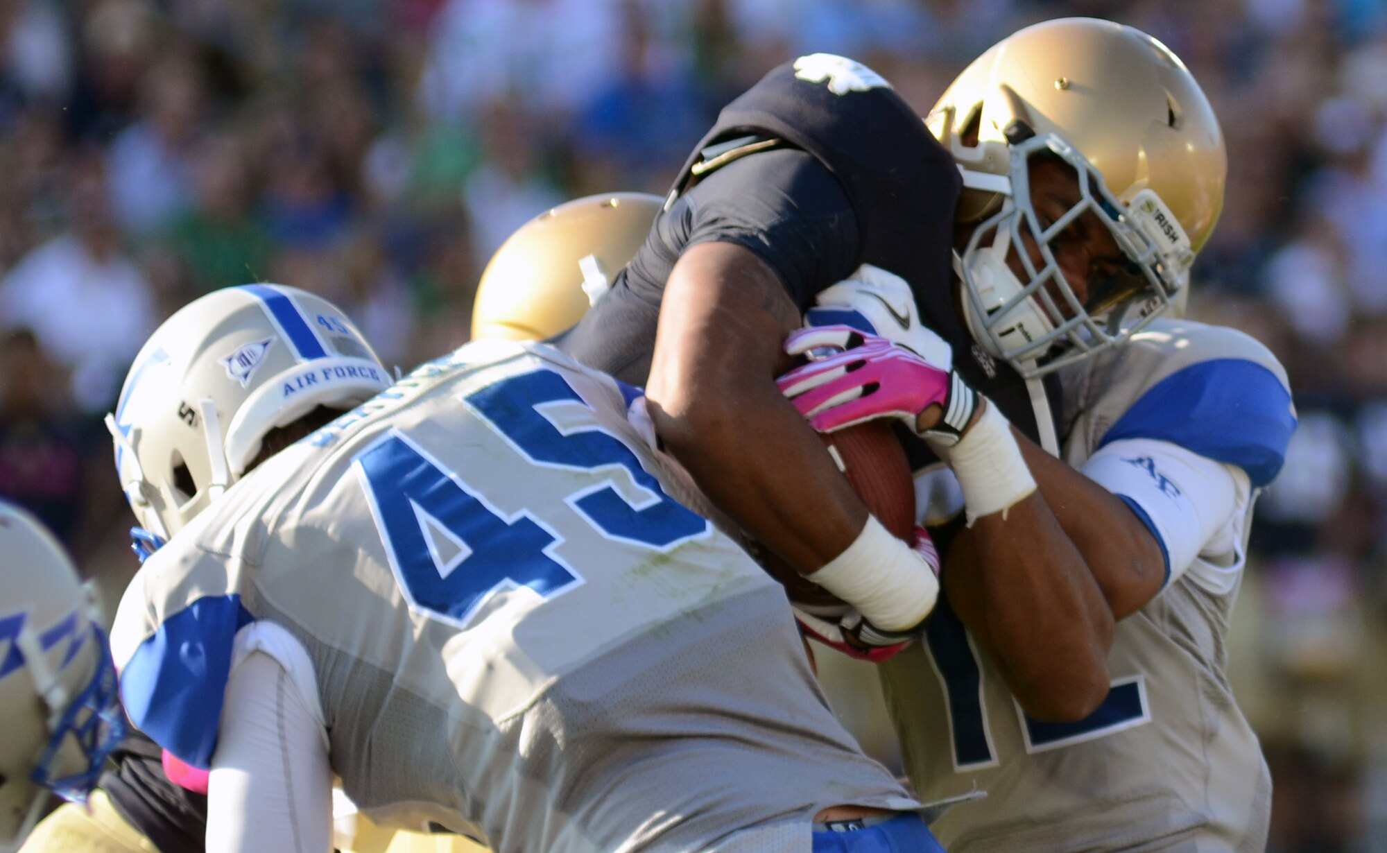 Notre Dame kick returner George Atkinson is gang tackled by Air Force special teams Saturday, Oct. 8, 2011 at Notre Dame Stadium. The Irish rolled on the Falcons 59-33. The victory lifts the Irish to a 4-2 record while the Falcons drop to 3-2. (U.S. Air Force photo/Tech. Sgt. Raymond Hoy)