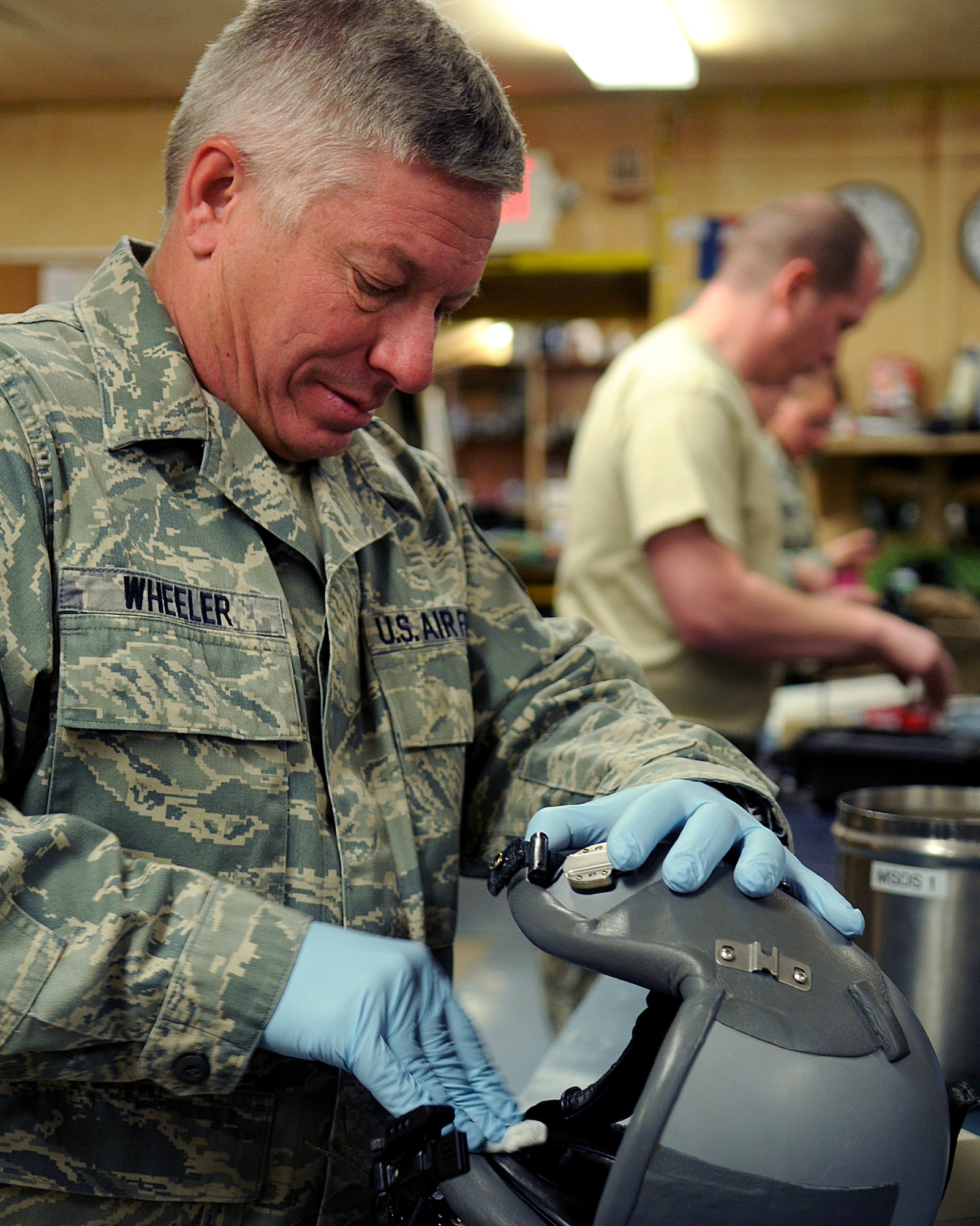BAGRAM AIRFIELD, Afghanistan -- Master Sgt. David Wheeler, 455th Expeditionary Operations Group life support superintendant, cleans a helmet during a
routine post-flight equipment cleaning and serviceability check here Sept.
03, 2011. David is deployed from Rhode Island Air National Guard and is a native
of Warwick, R.I. (U.S. Air Force photo/Senior Airman Krista Rose)
