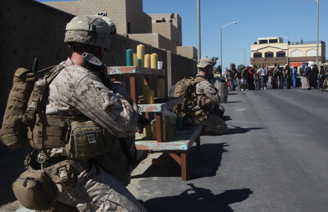 Marines with Battalion Landing Team 3/1, 11th Marine Expeditionary Unit provide security during a noncombatant evacuation exercise here Oct. 8. The unit embarked USS Makin Island, USS New Orleans and USS Pearl Harbor in San Diego Sept. 28 and is participating in its final exercise before deploying in November.