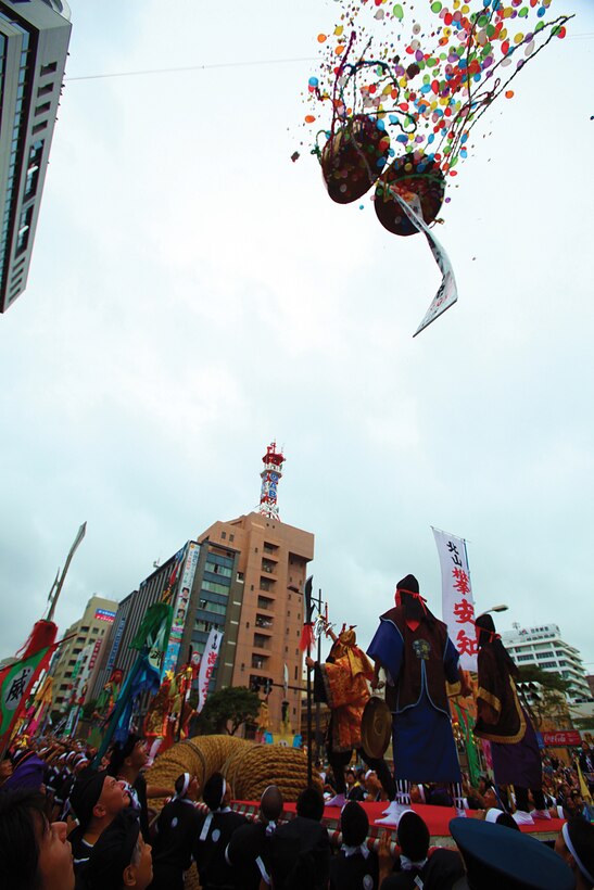 At the 41st Annual Naha Tsunahiki, or Naha Great Tug of War, actors dressed to symbolize the Battle of East and West, which dates back to the 17th century, stand atop the rope and yell out commands in hopes that their side will be the victor in downtown Naha Oct. 9.